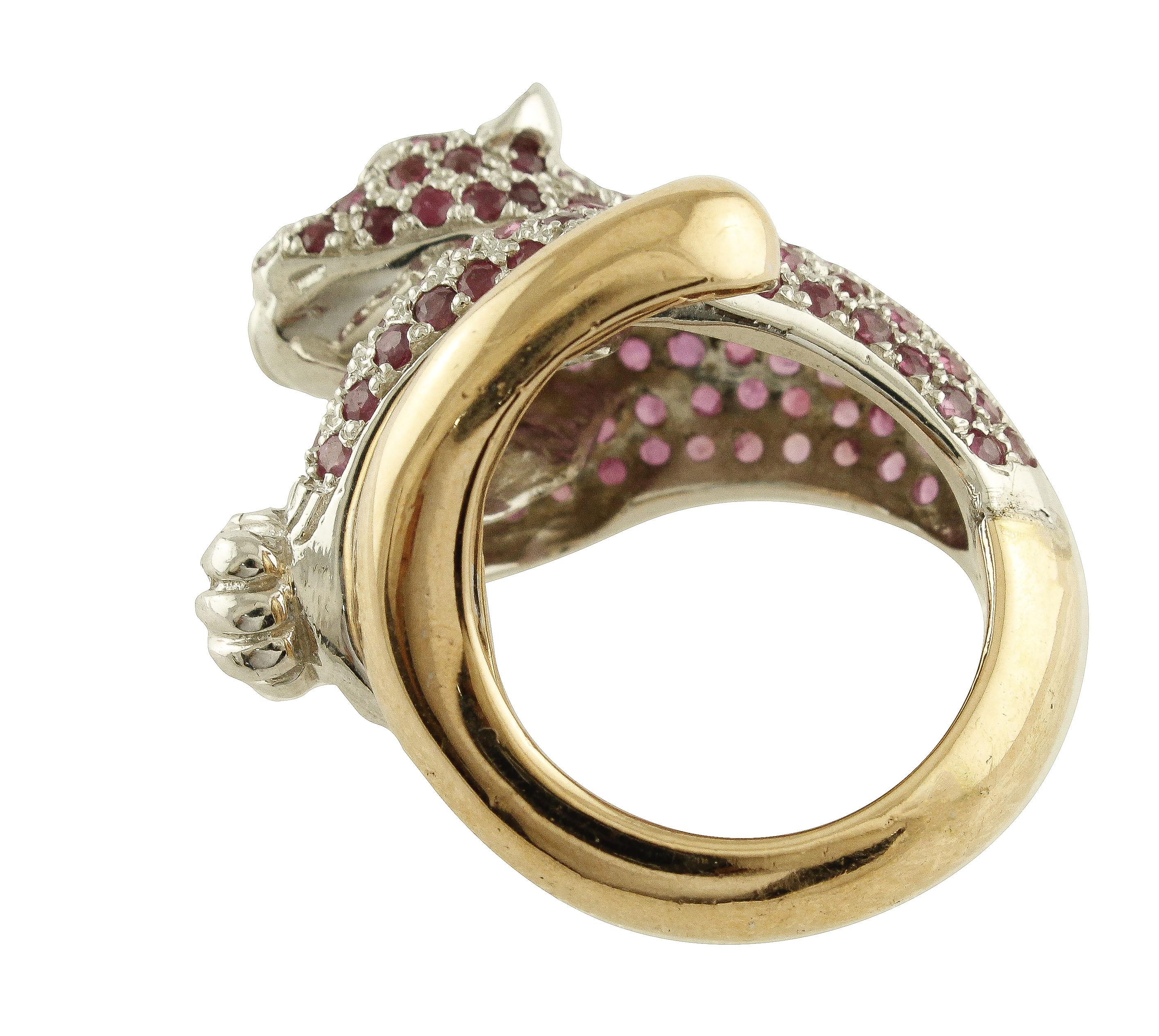Gorgeous ring in 9K rose gold and silver structure. It has cheetah shape, the body studded by rubies and two white diamonds as eyes.
Diamonds 0.14 ct 
Rubies 5.55 ct 
Total Weight   17.40 g 
R.F *uaoo
Italian size 13
French size 53
Usa size