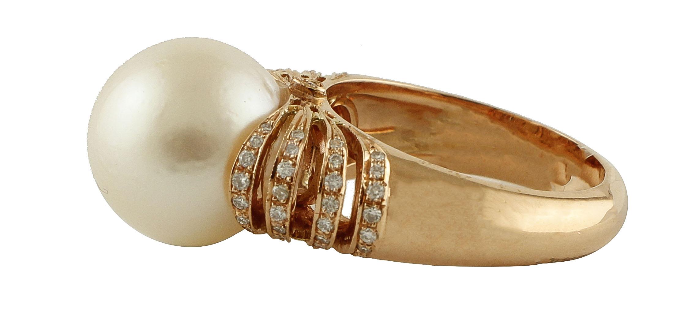 Elegant and simple cluster ring in 18K rose gold structure composed of 3.20 g of white glossy big pearl (13 mm) and on the two sides there are 8 stripes in 18K rose gold (4 on rhe right, 4 on the left) embellished by very little white