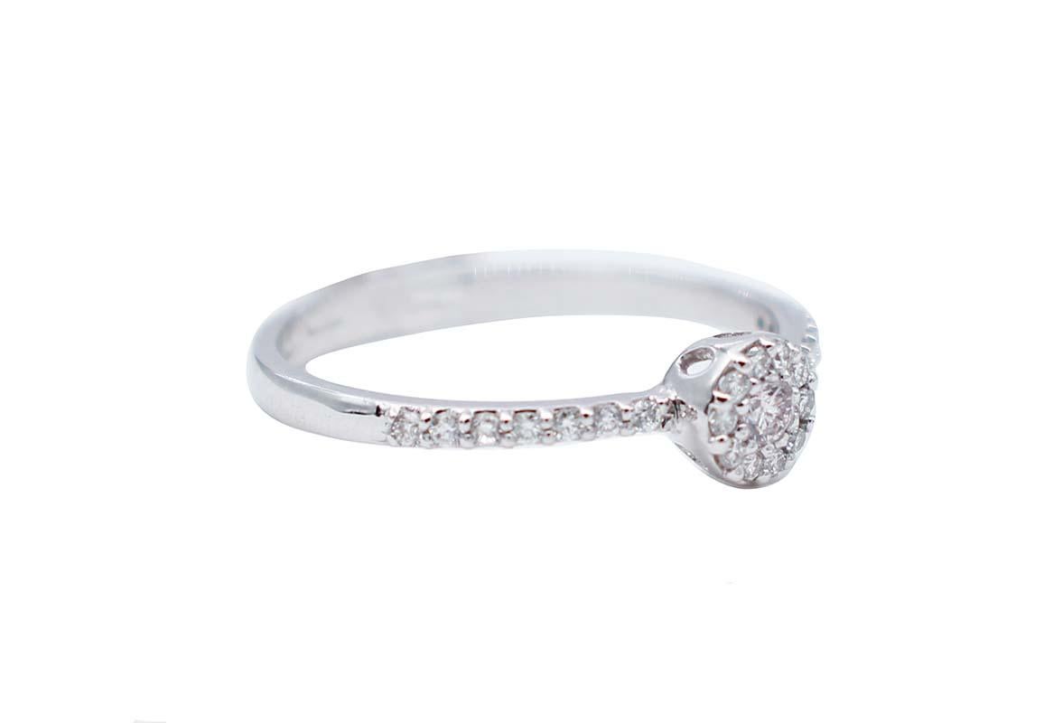 Elegant engagement ring in 18 karat white gold structure mounted with a central diamond surrounded by white diamonds.
Diamonds 0.32 ct
Total Weight 1.80 gr
RF   RF    G    GUFO
RK.AGCG88
Italian Size 15
Usa Size 7.17
French Size 55

For any