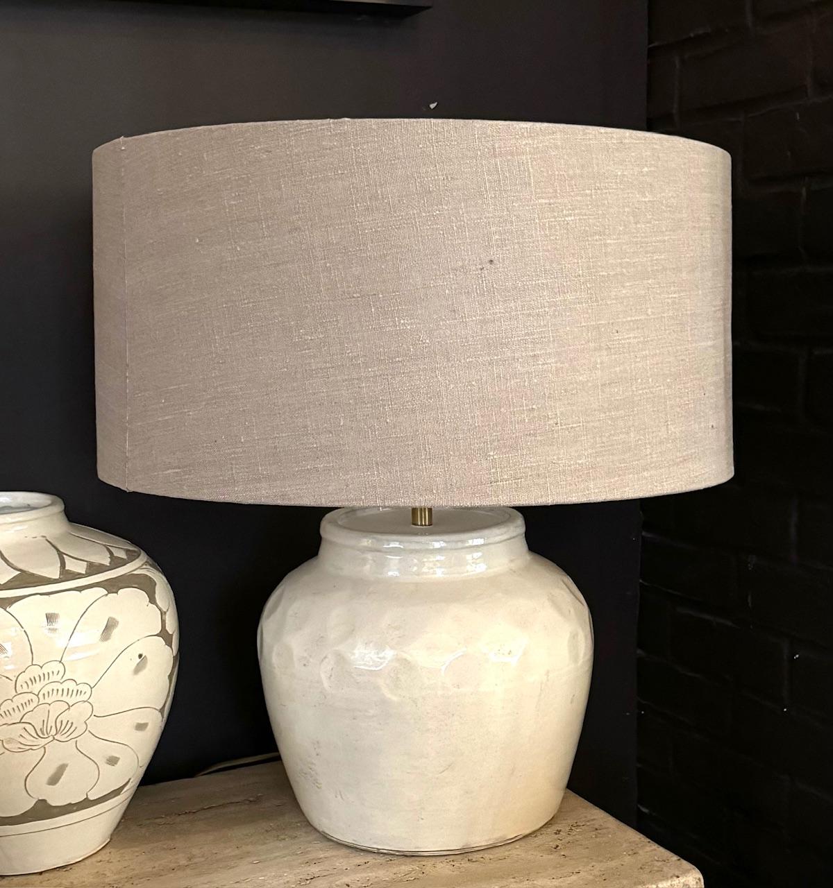 Contemporary Chinese pair of white lamps with dimple impressed textured design.
Base measures 11