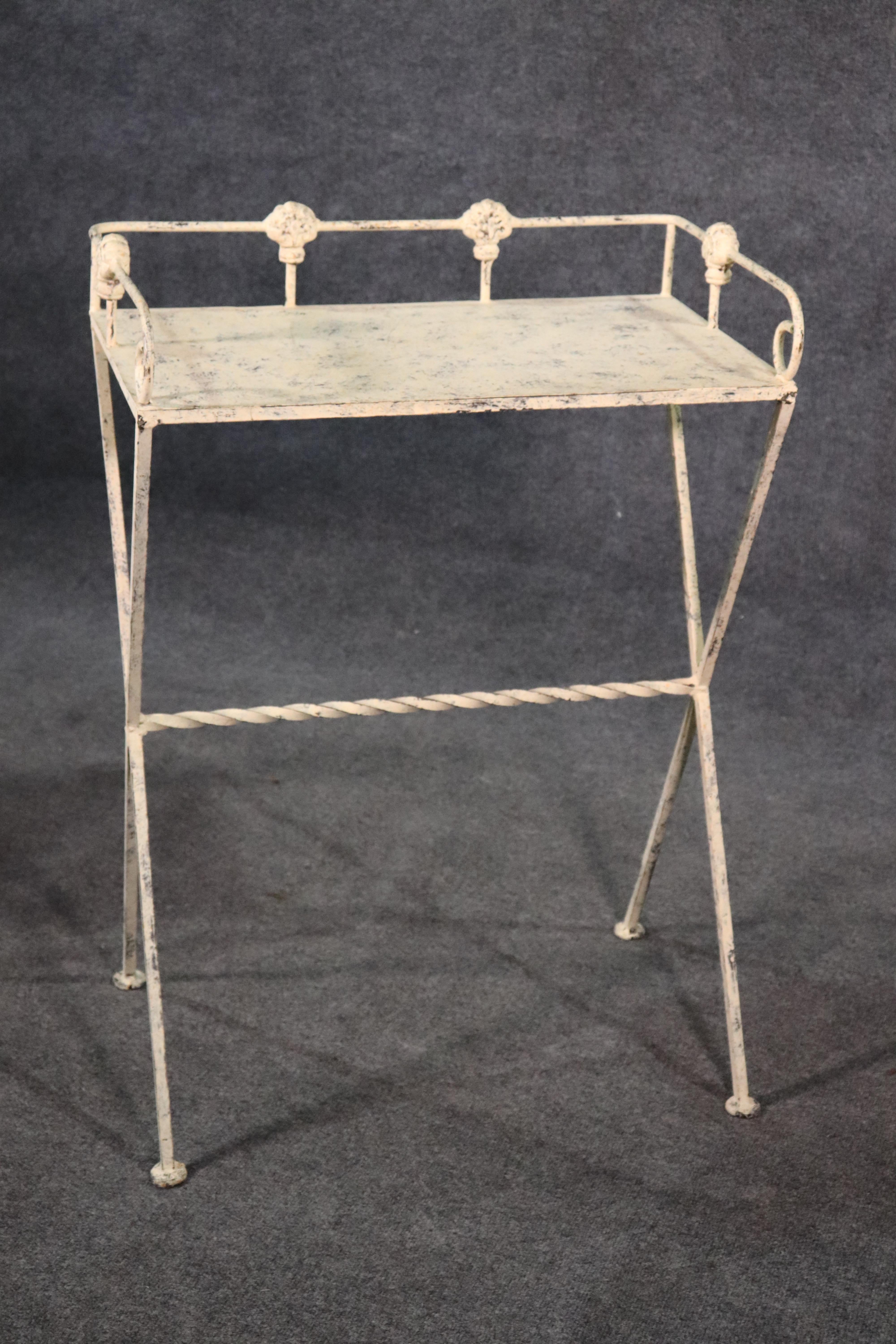 This is a charming white painted French stand. It can be used for almost anything as it is substantial and heavy for its size and light visual weight. Measures 36.25 tall x 26 wide x 15 deep.