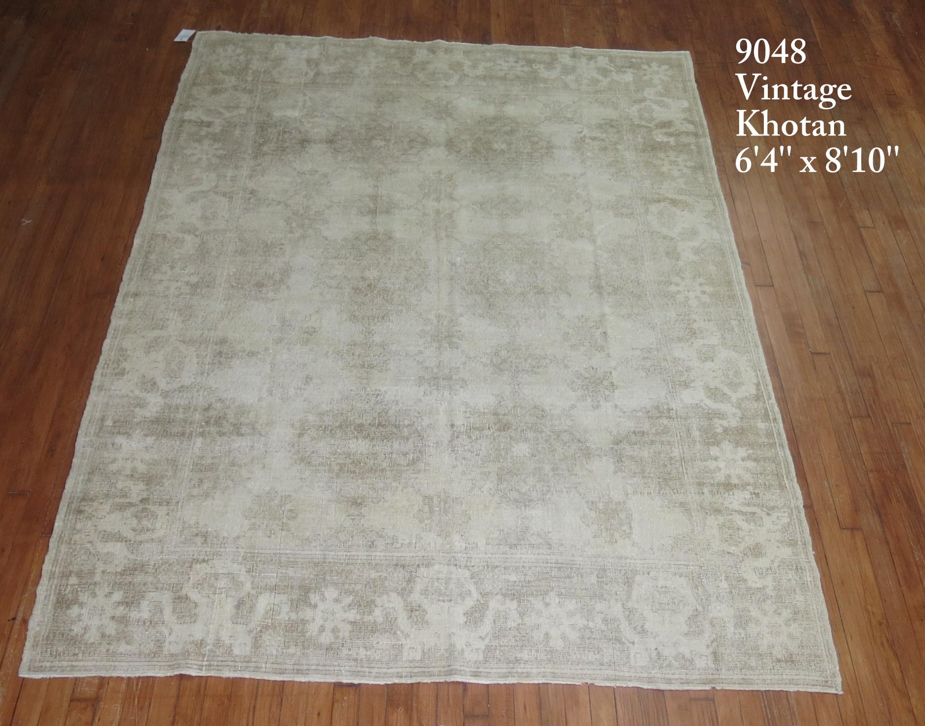 A mid-20th century weather textured or distressed East Turkestan Khotan rug.