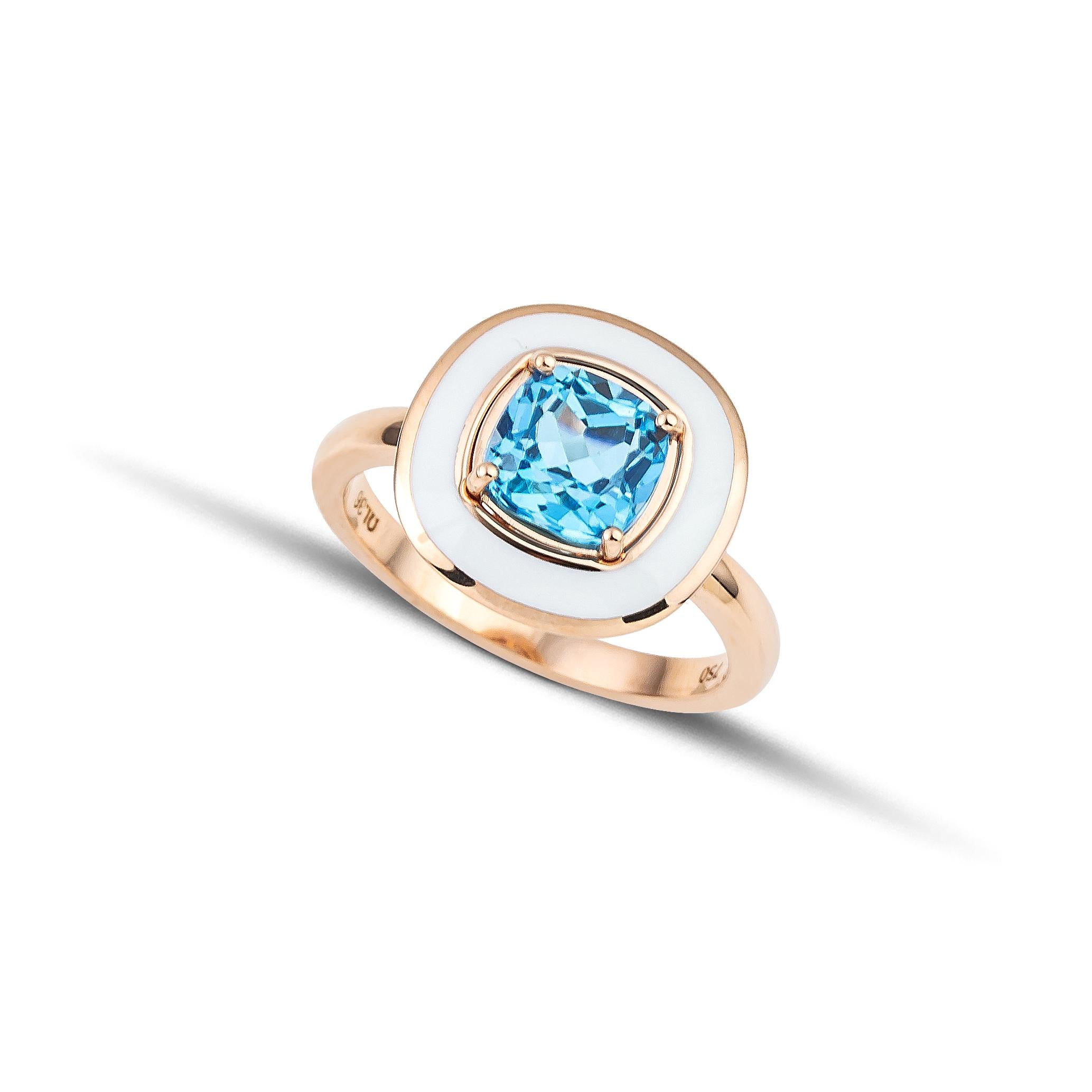 White Enamel Cocktail Ring with 2.15 carat Cushion Blue Topaz made in 18 Kt Rose Gold. 
A unique piece of jewelry handcrafted in 18Kt rose gold with a big 2.15 ct cushion Blue Topaz, set among four gold prongs. A white enamel circle around the Blue
