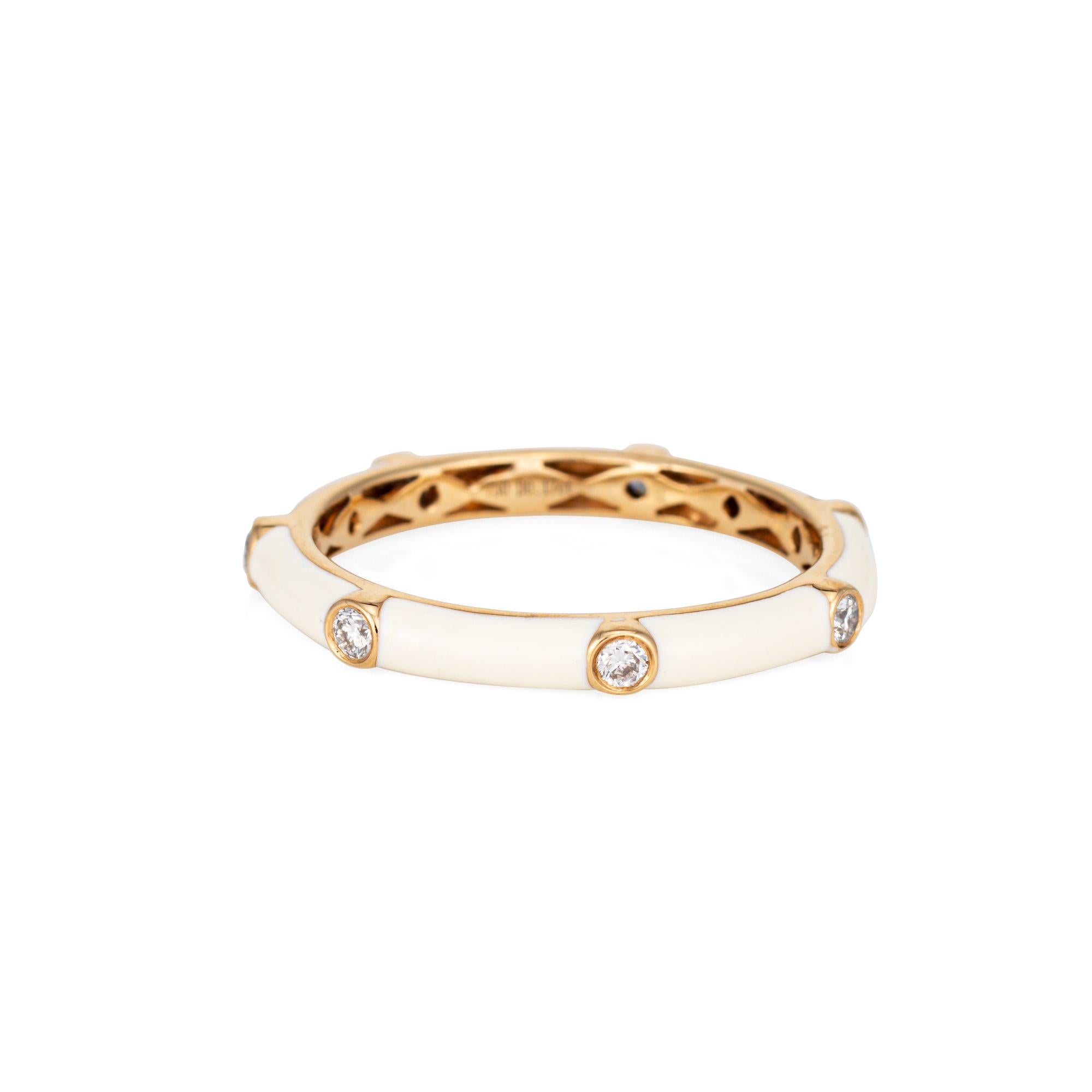 Stylish white enamel & diamond stacking band crafted in 18 karat yellow gold. 

7 round brilliant cut diamond totals an estimated 0.17 carats (estimated at H-I color and SI2 clarity). 

The white enameled band is set with small diamonds around the