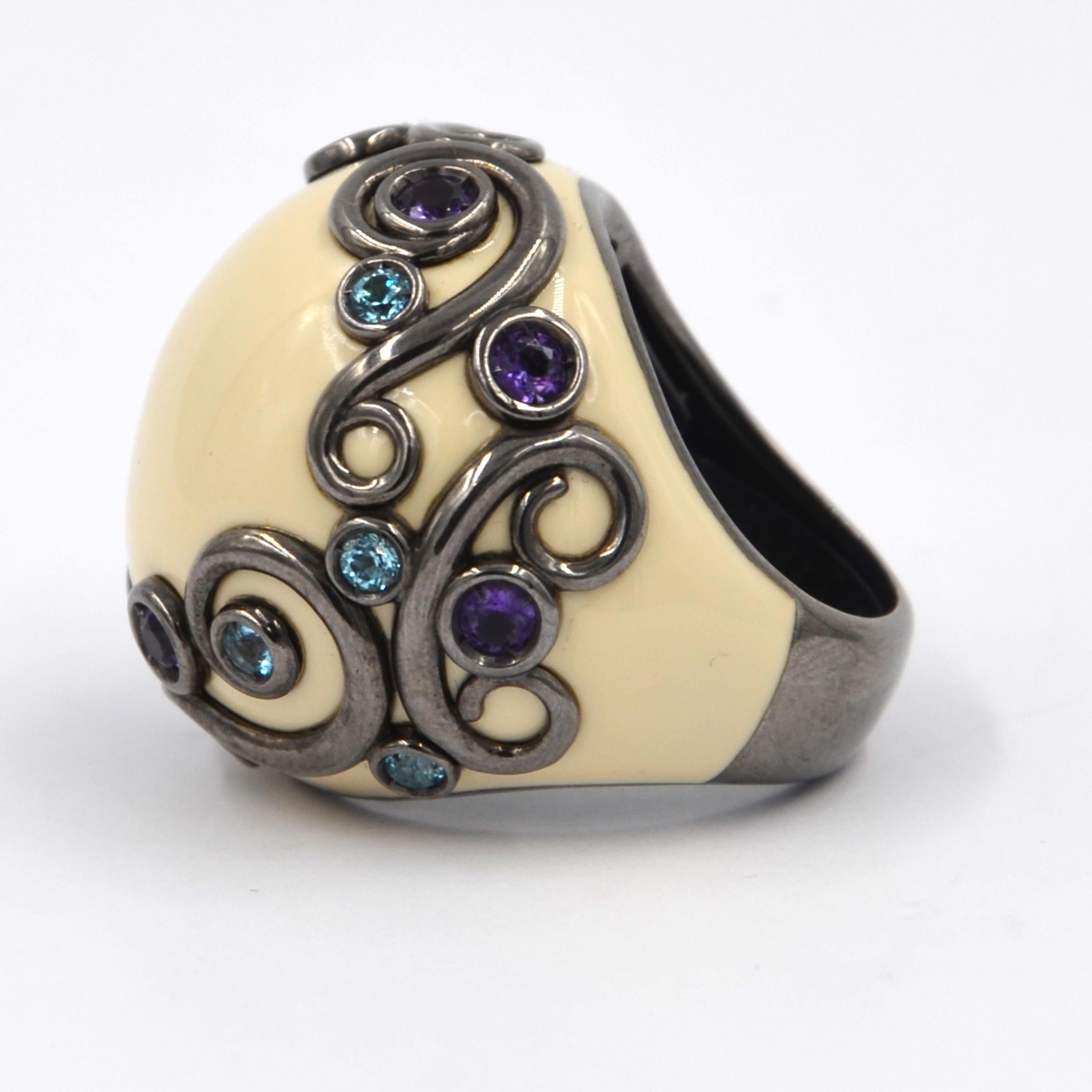 Originally designed across the millenium this fabulous ring is in silver and features a total of carat 1.39 of amethyst and blue topaz.  Handcrafted in Italy, from the Garavelli Lifestyle collection. 
Discover timeless elegance with our exclusive