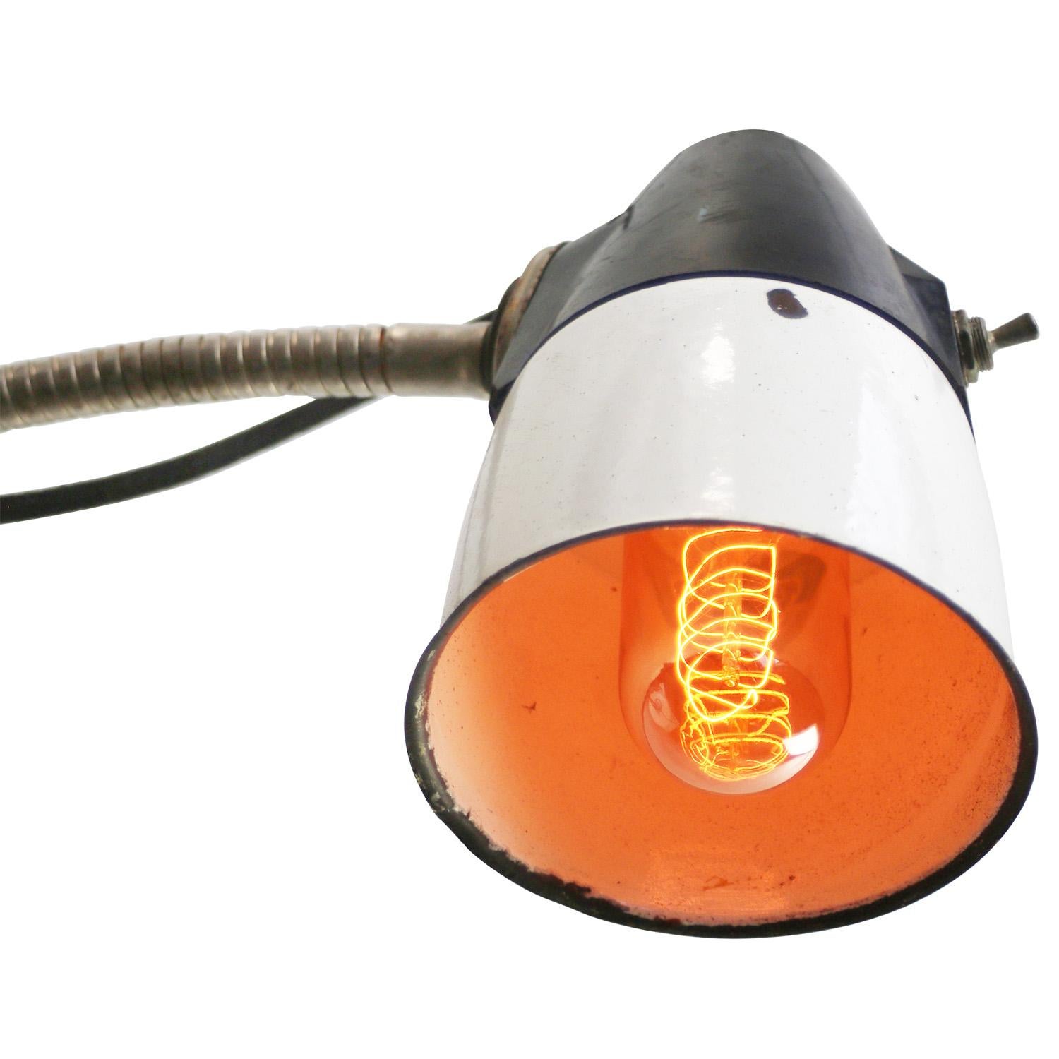 Metal work light with flexible gooseneck arm.
White enamel shade with Bakelite top
Switch in shade

size foot 9×9cm

Weight: 1.40 kg / 3.1 lb

Priced per individual item. All lamps have been made suitable by international standards for incandescent