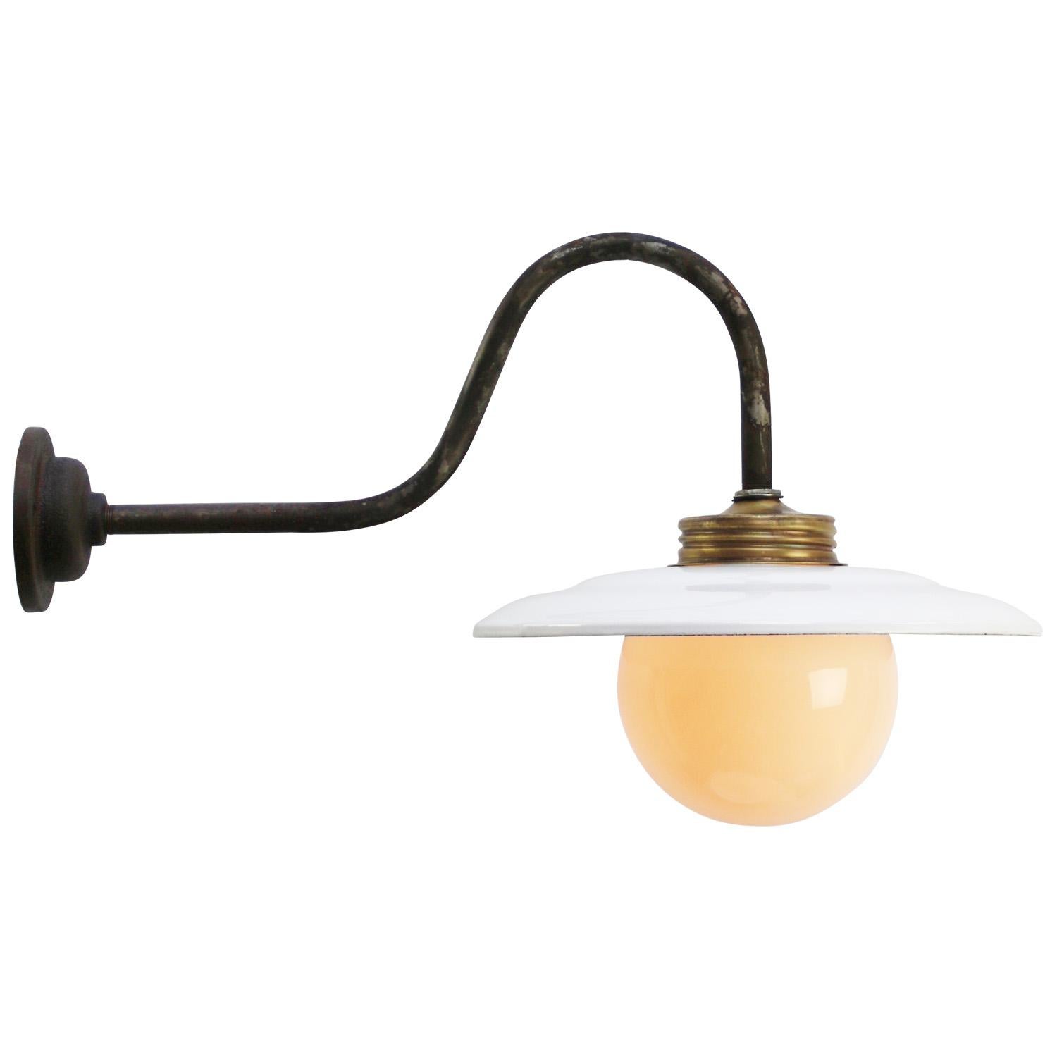 White enamel industrial wall light with white interior.
cast iron, opaline glass globe.

diameter cast iron wall mount: 10.5 cm / 4” cm, 2 holes to secure.

Weight: 1.80 kg / 4 lb

Priced per individual item. All lamps have been made suitable by