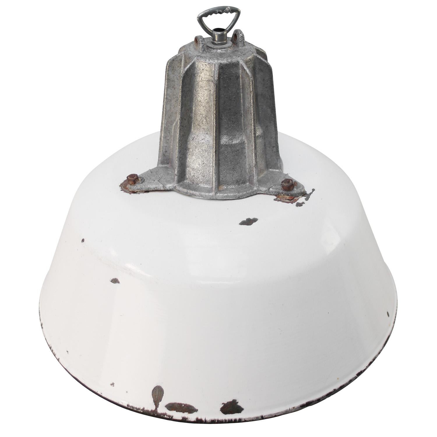 Industrial hanging lamp. White enamel. White interior.
Cast aluminium top.

Weight: 2.0 kg / 4.4 lb

Priced per individual item. All lamps have been made suitable by international standards for incandescent light bulbs, energy-efficient and LED