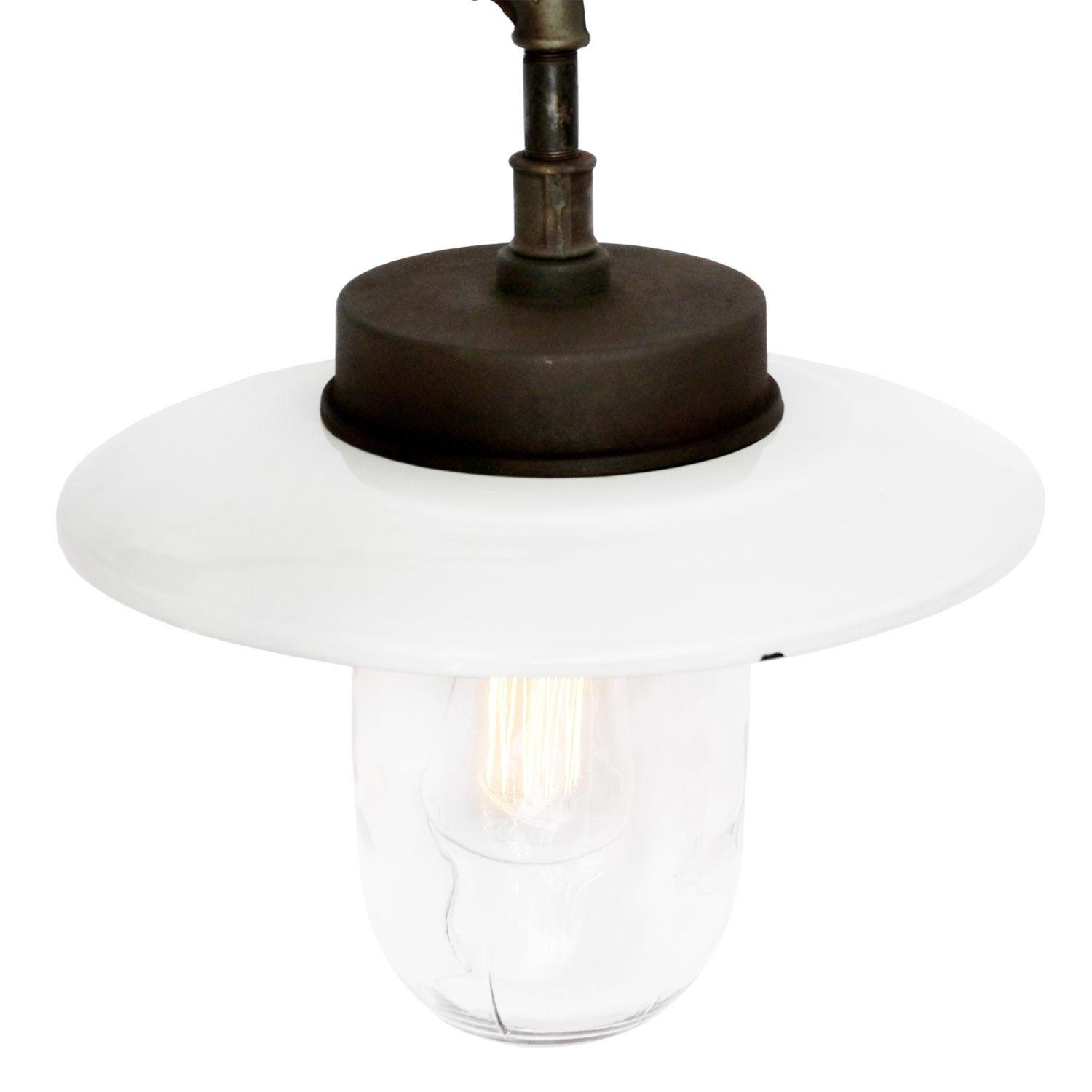 White enamel industrial wall light. 
Clear glass. Measures: 

Diameter cast iron wall piece: 12 cm. Three holes to secure.

Weight: 6.5 kg / 14.3 lb

All lamps have been made suitable by international standards for incandescent light bulbs,