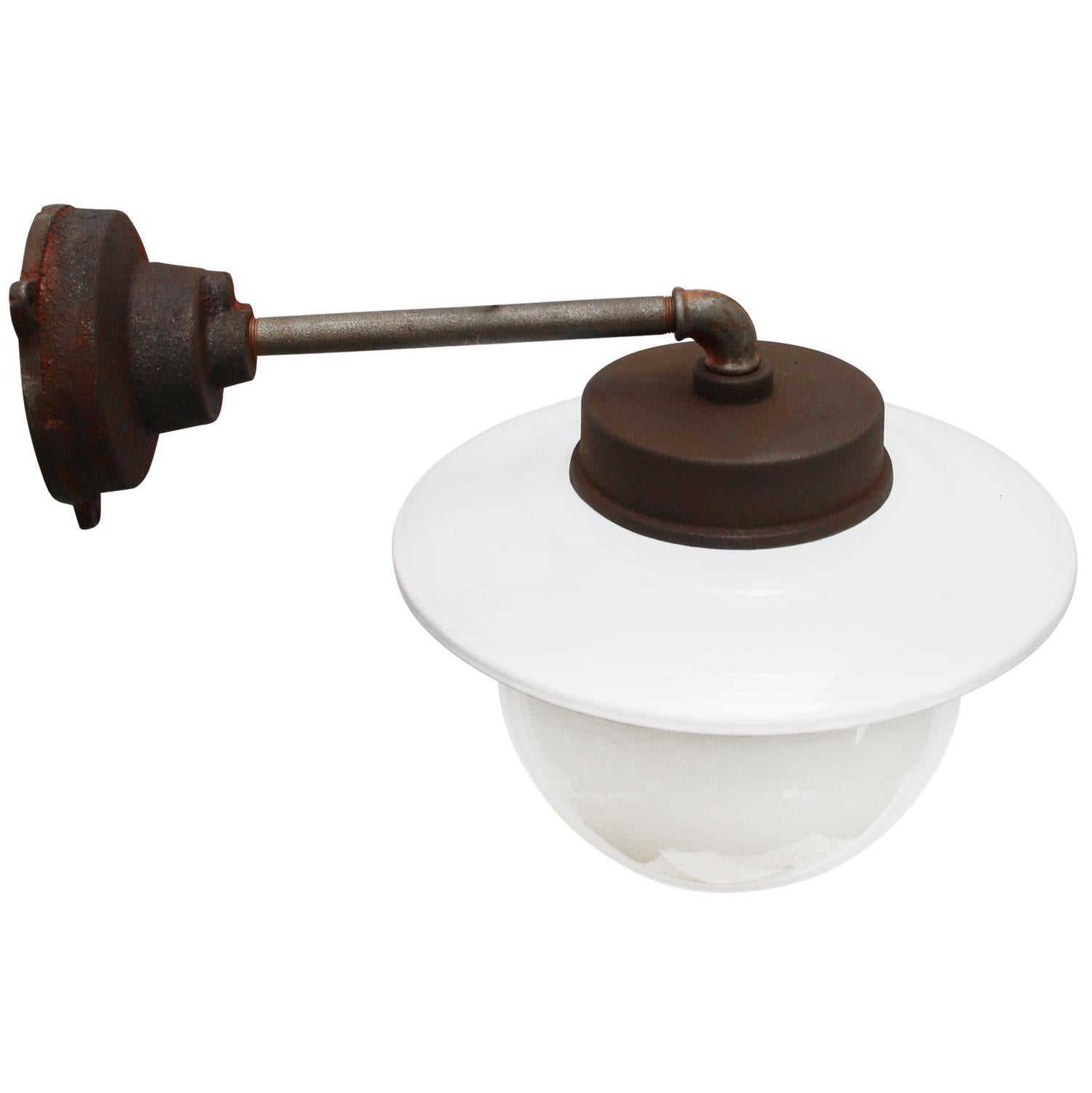 White enamel Industrial wall light.
Opaline glass. Measures: 

Diameter cast iron wall piece 12 cm. Three holes to secure.

Weight: 6.5 kg / 14.3 lb

All lamps have been made suitable by international standards for incandescent light bulbs,