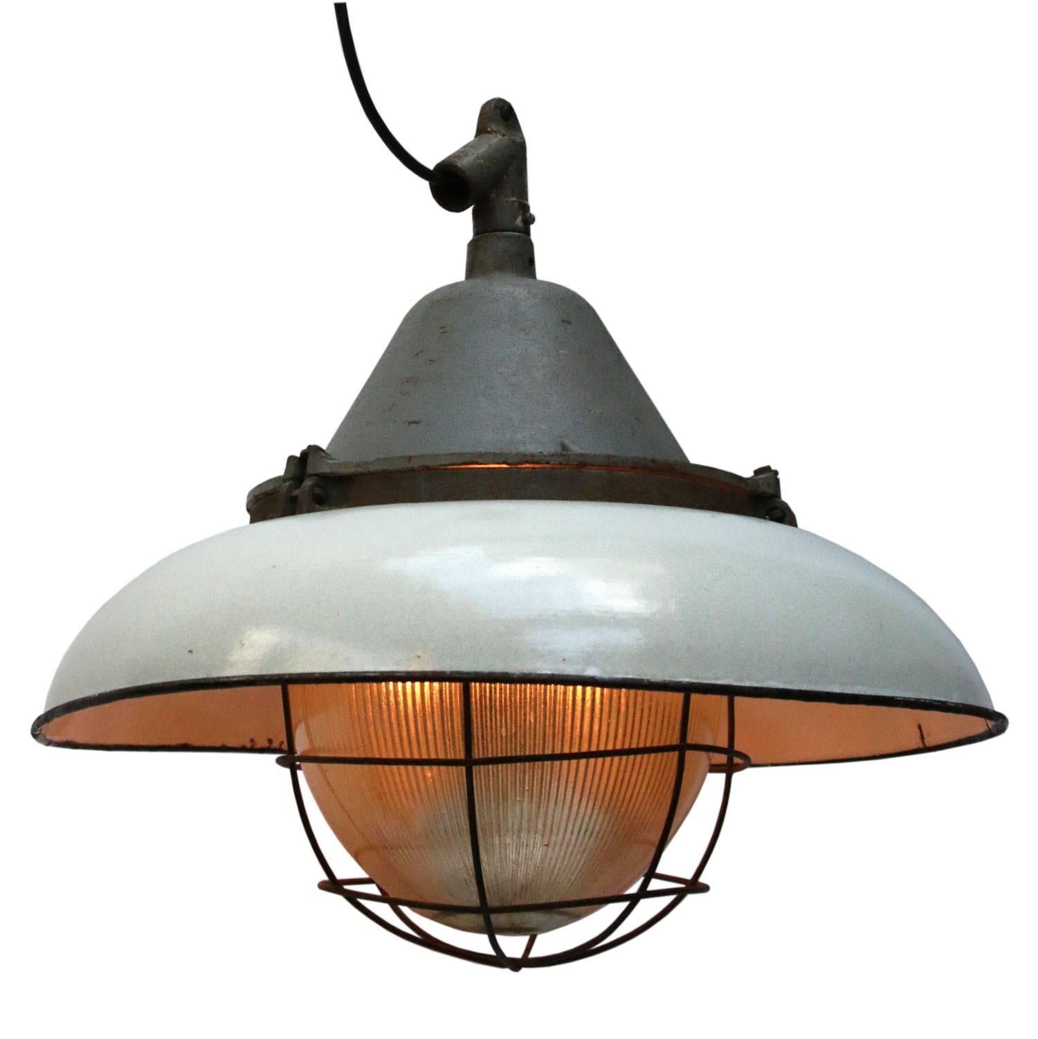 Factory pendant. White enamel white interior. Cast iron top.
Holophane glass.

Weight: 9.0 kg / 19.8 lb

All lamps have been made suitable by international standards for incandescent light bulbs, energy-efficient and LED bulbs. E26/E27 bulb holders