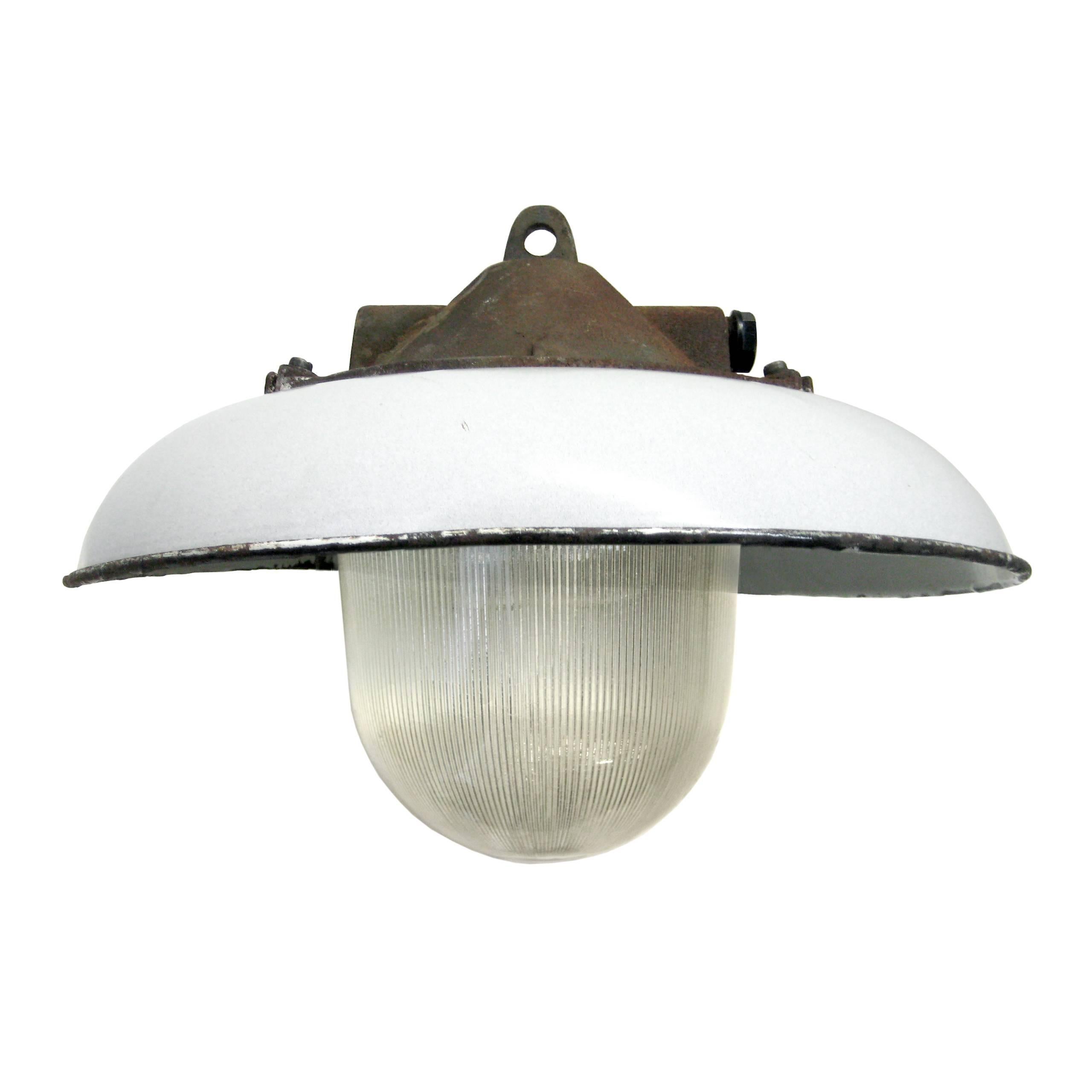 Industrial factory pendant. White enamel shade.
Cast iron top. Holophane glass.

Weight: 6.0 kg / 13.2 lb

Priced per individual item. All lamps have been made suitable by international standards for incandescent light bulbs, energy-efficient