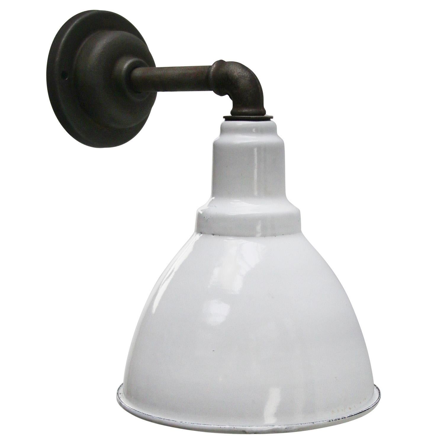 Industrial wall light
White enamel shade, cast iron arm and wall plate

Siameter cast iron wall piece: 10.5 cm / 4”, 2 holes to secure

Weight: 1.80 kg / 4 lb

Priced per individual item. All lamps have been made suitable by international standards