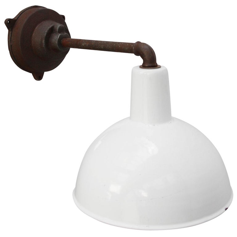 Factory wall light
white enamel, white interior

Diameter cast iron wall piece: 12 cm, 3 holes to secure

E27 / E26

Weight: 3.00 kg / 6.6 lb

Priced per individual item. All lamps have been made suitable by international standards for