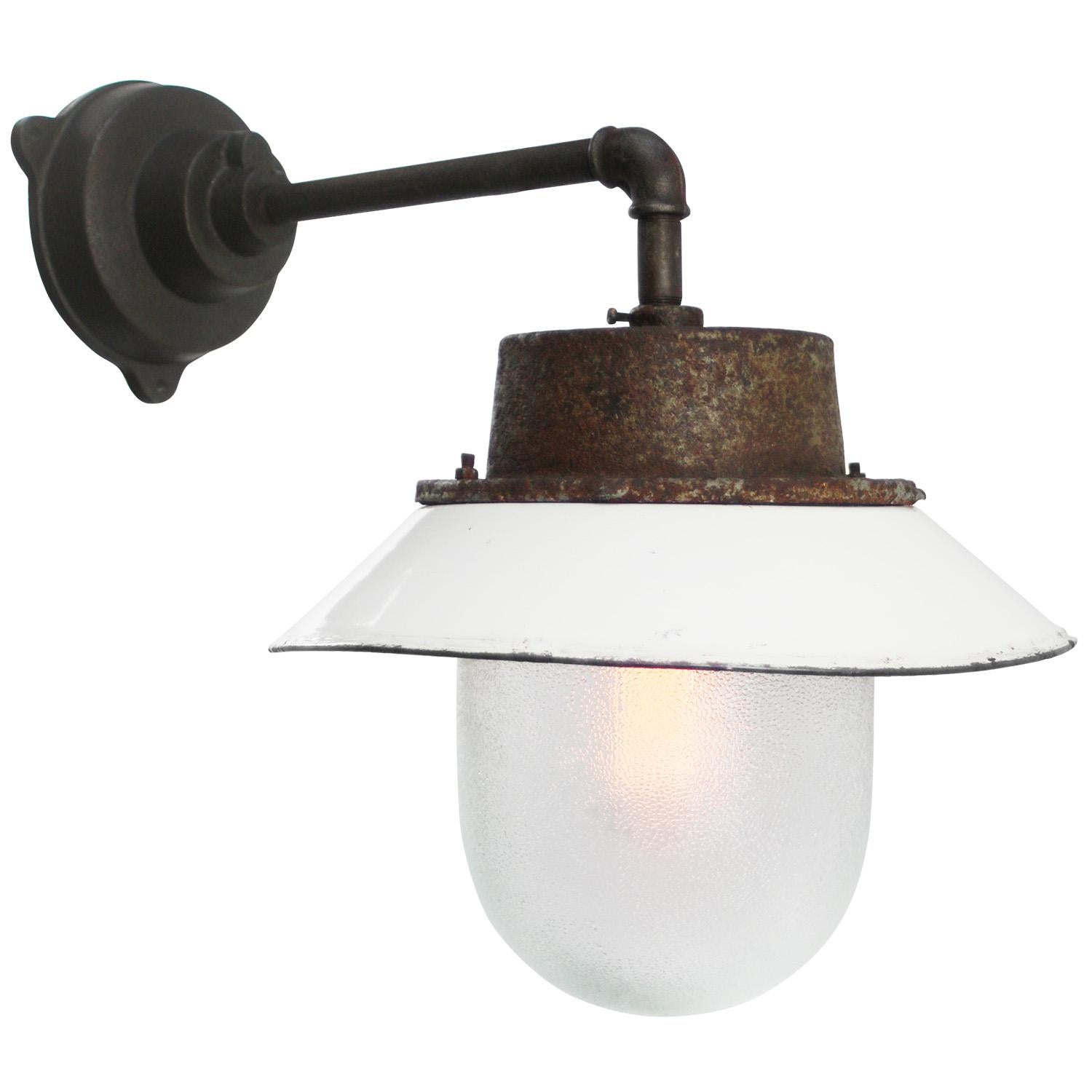 White enamel industrial wall lamp with white interior.
Frosted glass. 

Diameter cast iron wall piece: 12 cm. Three holes to secure.

Weight: 6.70 kg / 14.8 lb

Priced per individual item. All lamps have been made suitable by international standards