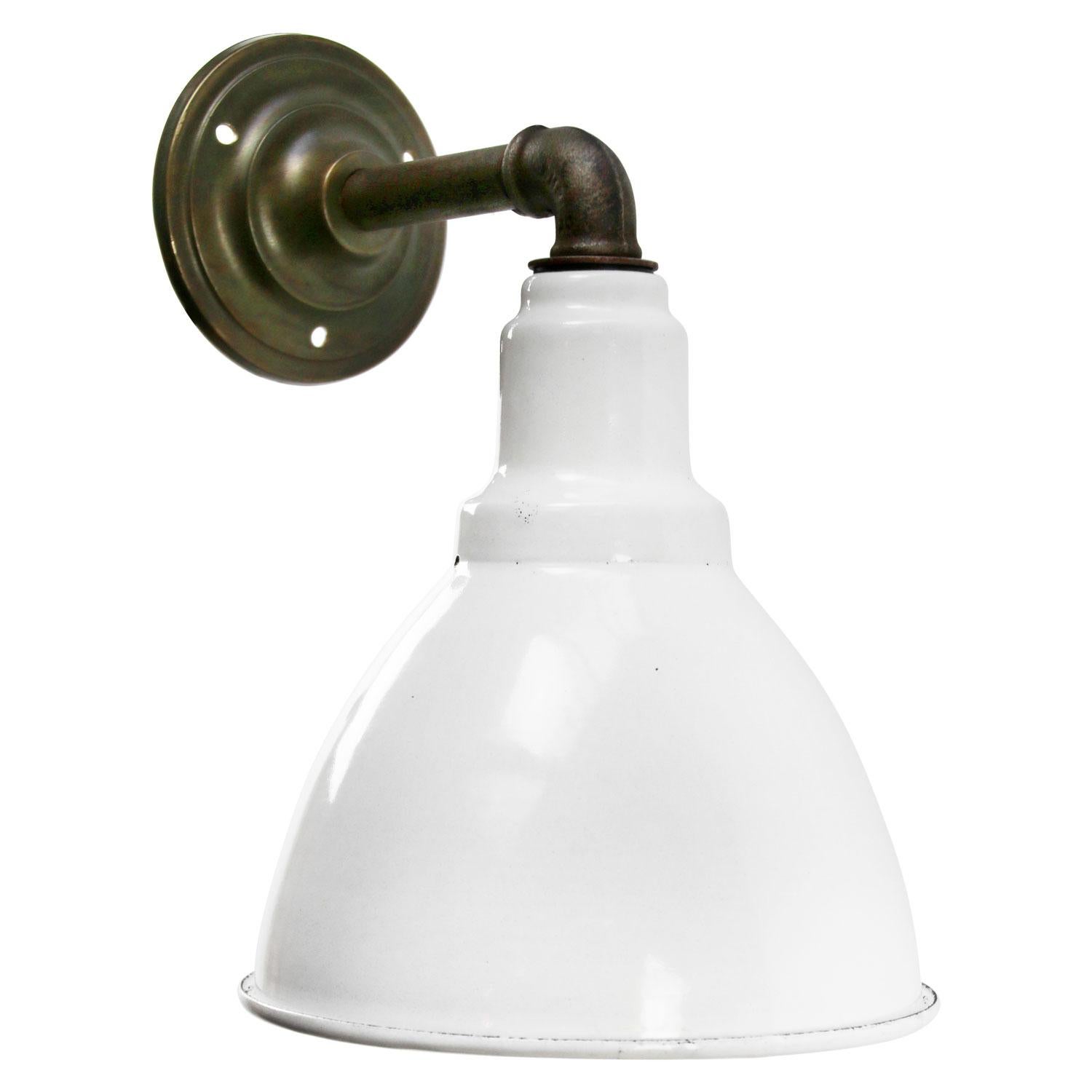 Factory wall light
White enamel shade, cast iron arm and brass wall plate

Diameter cast iron wall piece: 10 cm, 2 holes to secure

Weight: 1.80 kg / 4 lb

Priced per individual item. All lamps have been made suitable by international