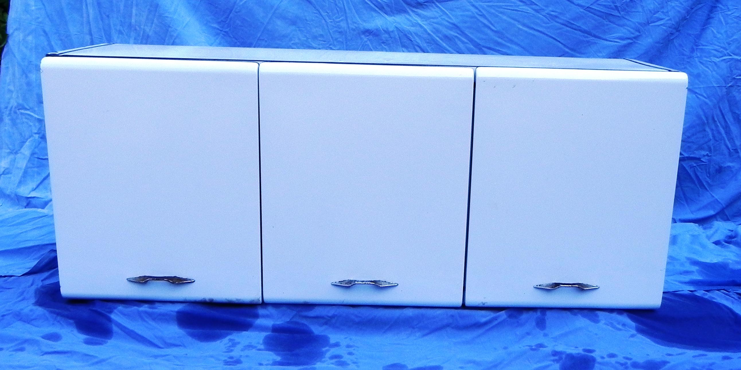 White enameled sheet metal hanging sideboard by Soal, made in France in the 1950s. The outside is in fair condition, internally it needs restoration.