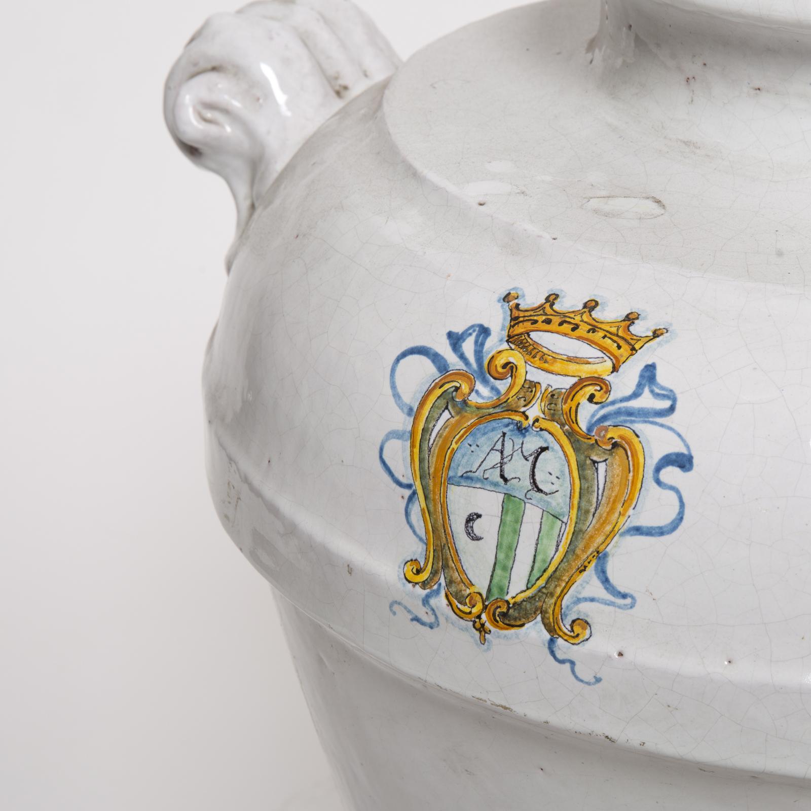Dainty ceramic jar in the characteristic style of Faenza, one of the major ceramic centers in Italy. The rather large vase is entirely handcrafted by the ceramic artists of Manetti e Masini in Florence. The decoration includes the hand-painted crest