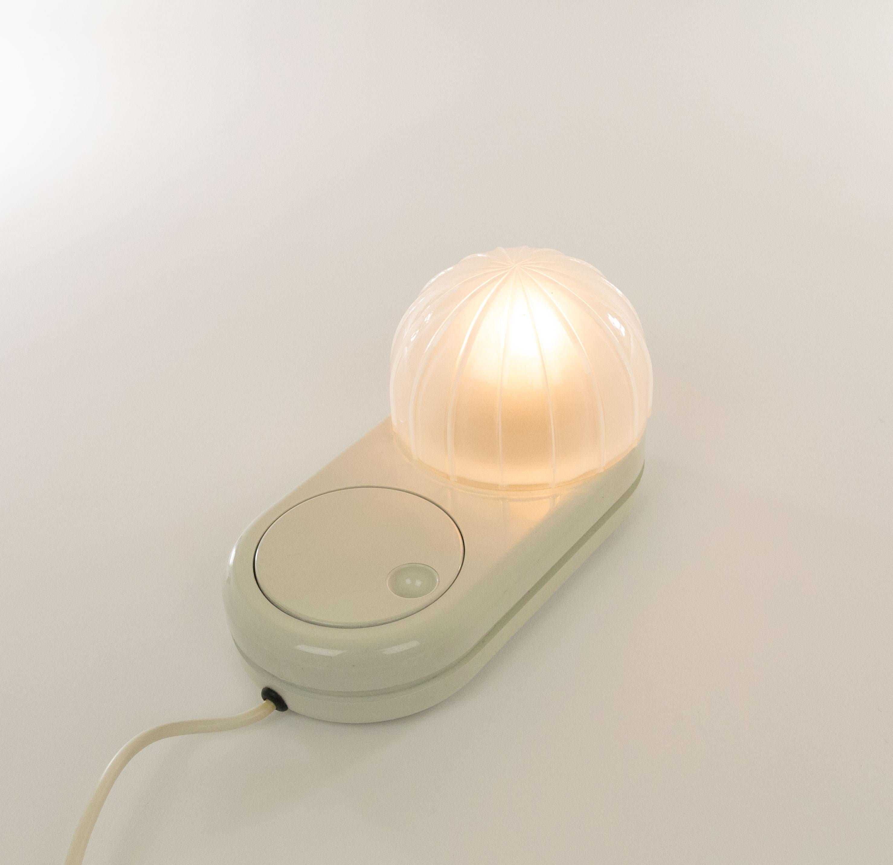 White Farstar table lamp designed by Adalberto Dal Lago (1973) and manufactured by Bieffeplast.

The dome shaped glass shade sits on a plastic base. The large round light dimmer that also functions as an on / off switch is a characteristic feature