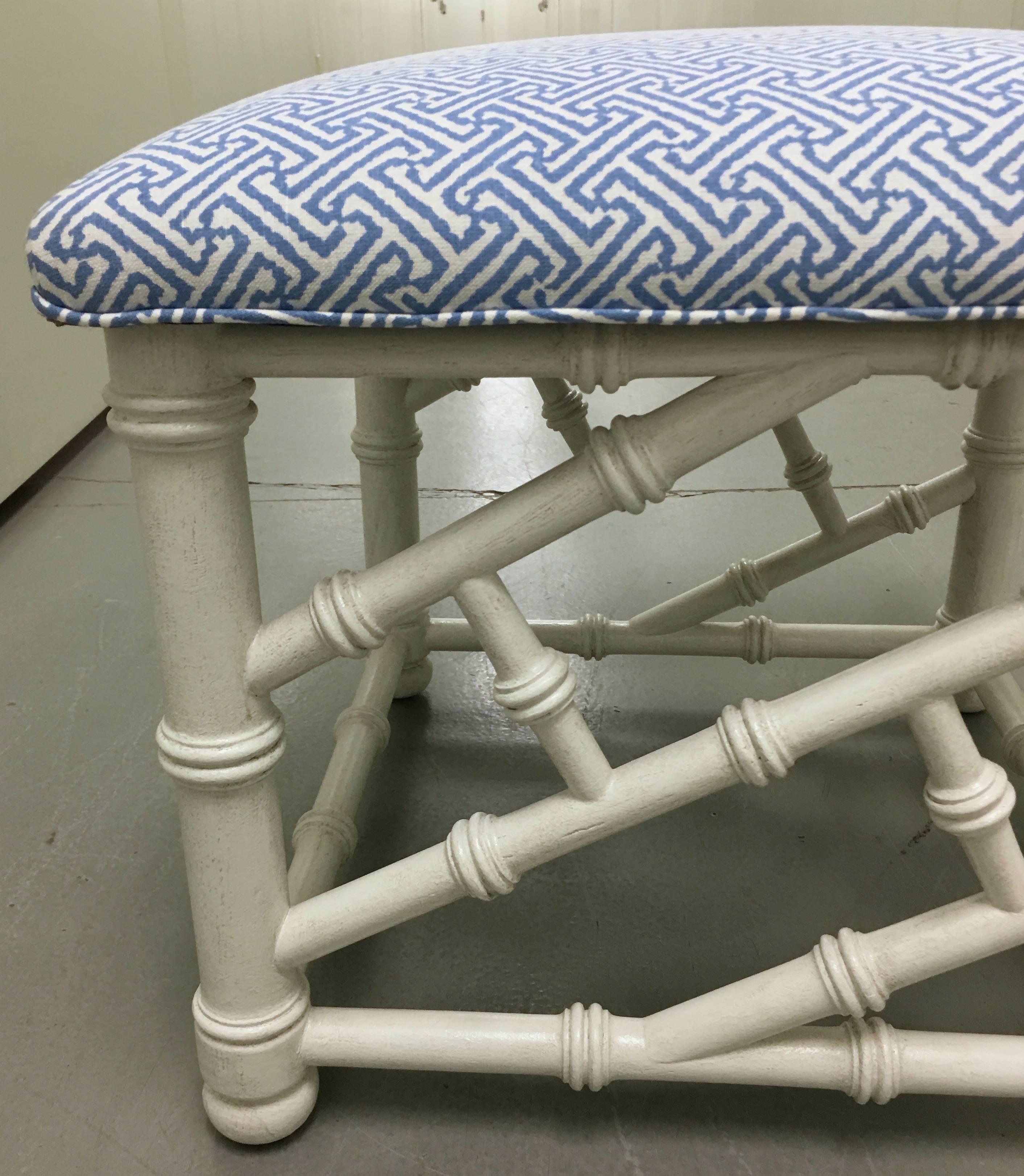 Antique white painted faux bamboo bench. Newly upholstered in Quadrille China Seas 'Java Java' linen blend in French blue/white.
