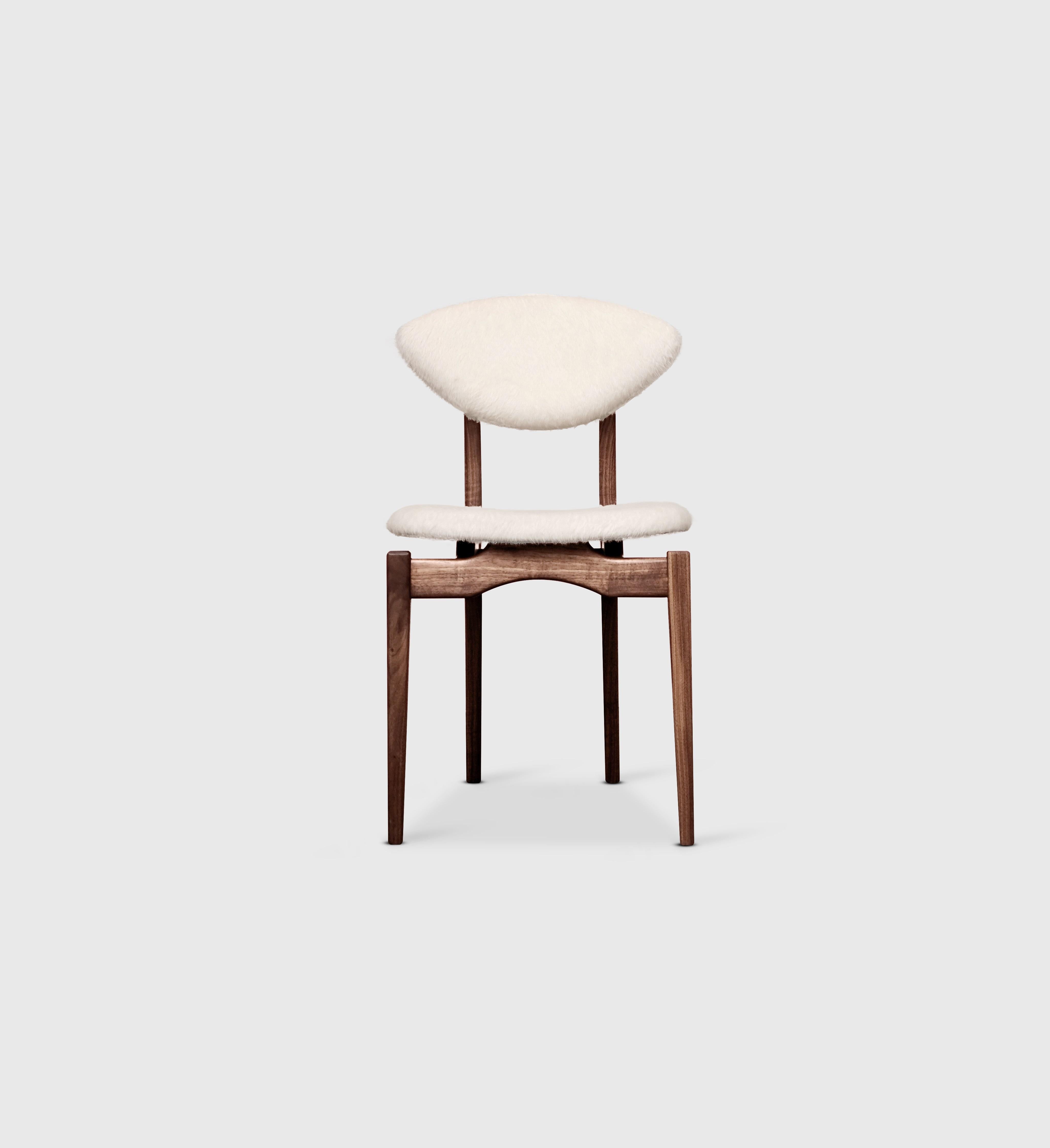 White Femur dining chair by Atra Design
Dimensions: D 58.5 x W 45 x H 85 cm
Materials: fabric, walnut
Available in leather or fabric seat and in other colors.

Atra Design
We are Atra, a furniture brand produced by Atra form a mexico