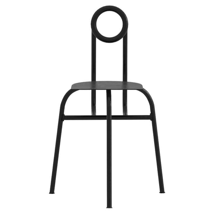 Fertility Chair, initially conceived by Leonardo Floresvillar in 2019 and crafted from galvanized aluminum coated with matte electrostatic paint, is a durable seating item with an industrial aesthetic. The chair features three sleek legs, and a