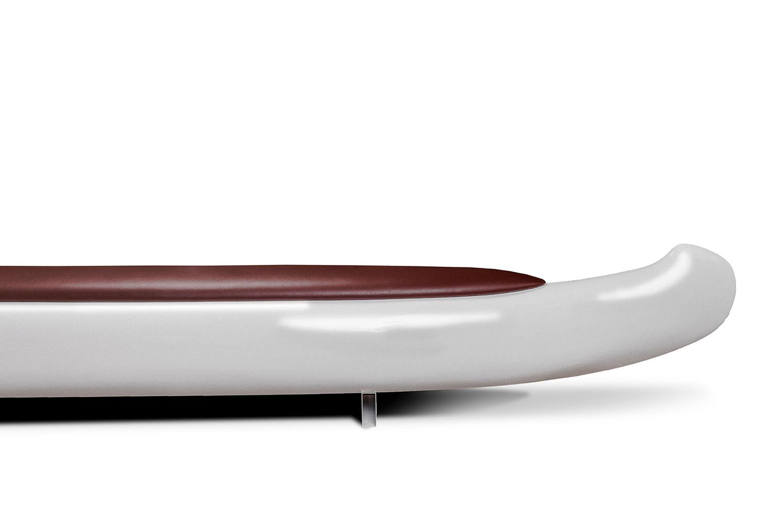 Made in Italy and designed by Verter Turroni, Trip Bench by Imperfetto is made from fiberglass with a brown leatherette seat and steel base. This sculptural furniture piece is a delightful place to light in both commercial and residential settings