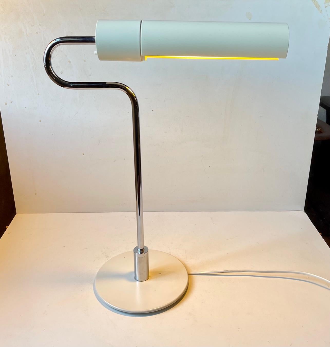 Interesting tubular desk or architects table lamp from Royal Copenhagen. It was designed during the 1980s by the Danish architect Jorgen Moller. The curled chromed plated stem resembles the neck of a Flamingo hence its name. It features an