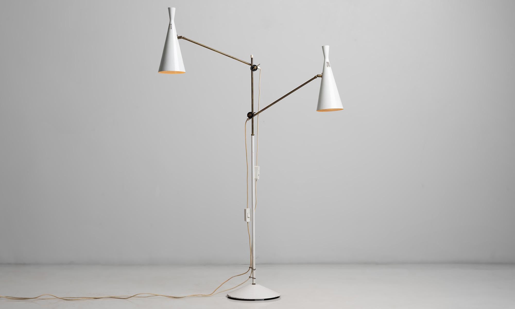 White floor lamp by GA Scott for Maclamp

England circa 1950

Two white metal shades with brass stem and adjustable arms.

As shown: 38”L x 10.5”base dia x 56”h.
 