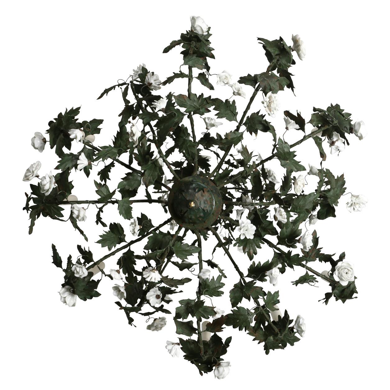 A French style vintage tole chandelier constructed of climbing green ivy and white enamel flowers with nine lights grouped in threes