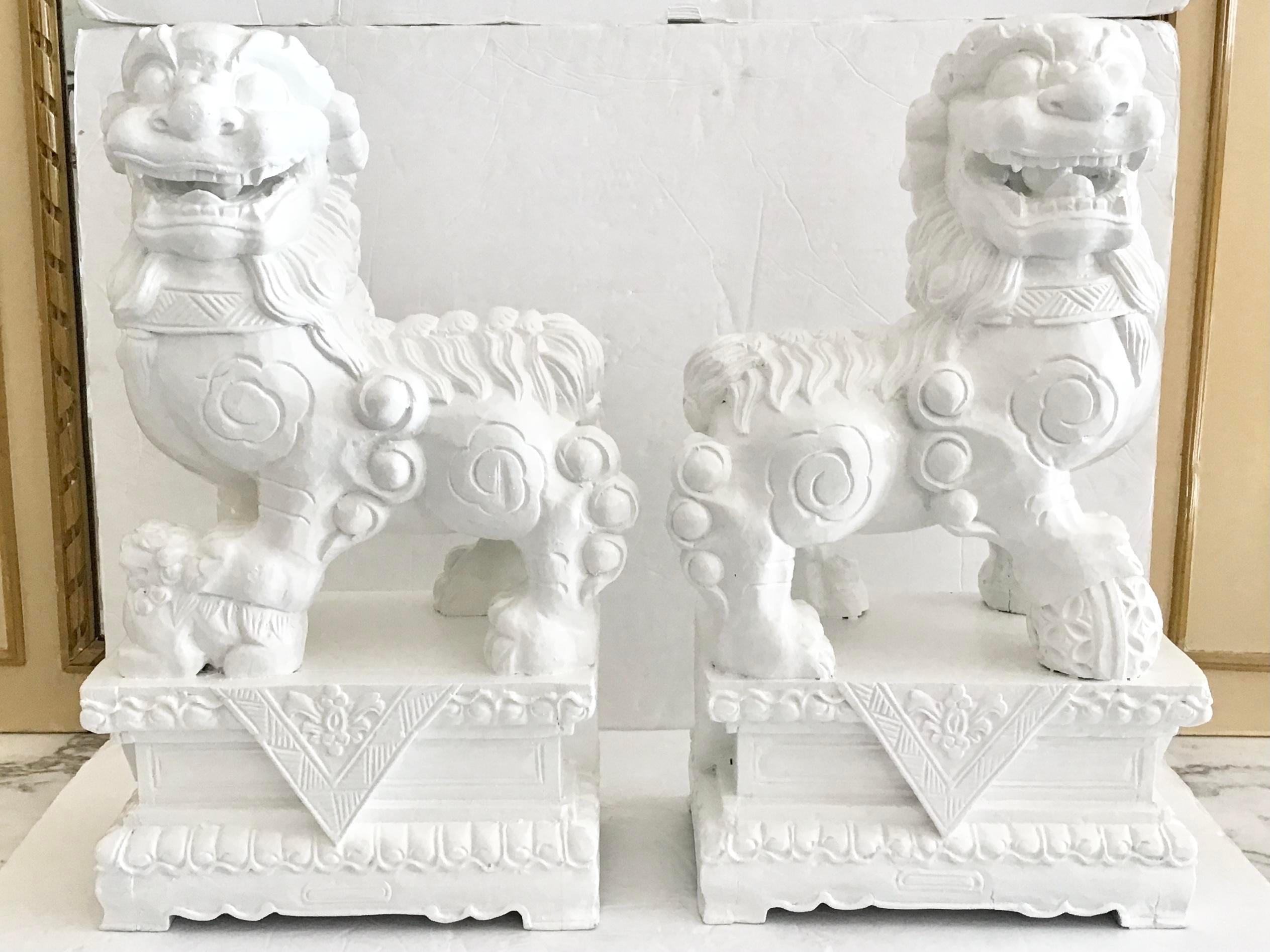 Chinoiserie White Foo Dogs Carved in Wood Base Floral Figures, a Pair For Sale