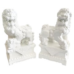 White Foo Dogs Carved in Wood Base Geometrical Figures, a Pair