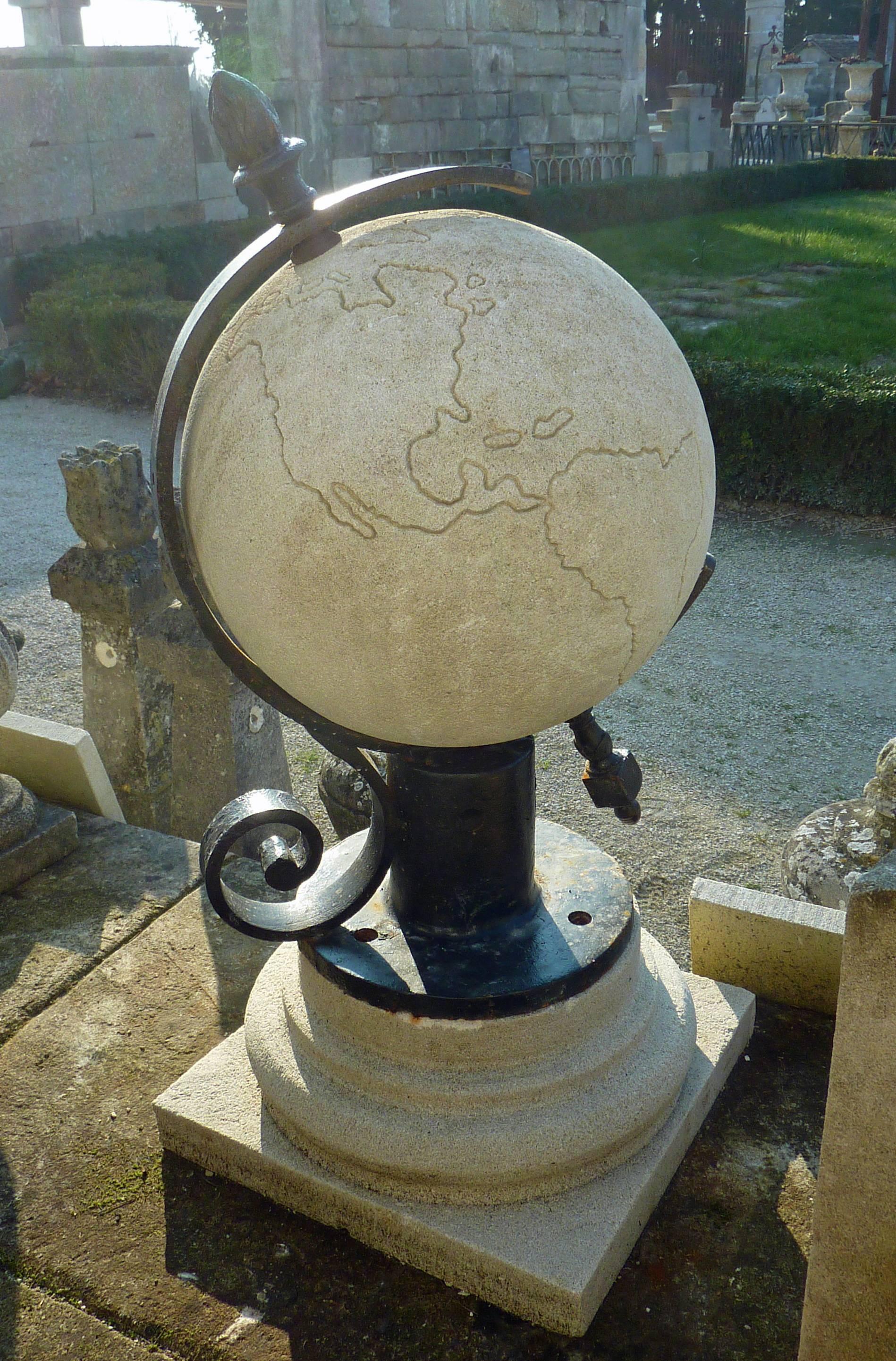A one of the kind original decorative element, this wonderful terrestrial globe is composed of natural French limestone extracted in Provence, the Estaillades stone, and of wrought iron.

Anchored to a round molded base in stone, this globe with