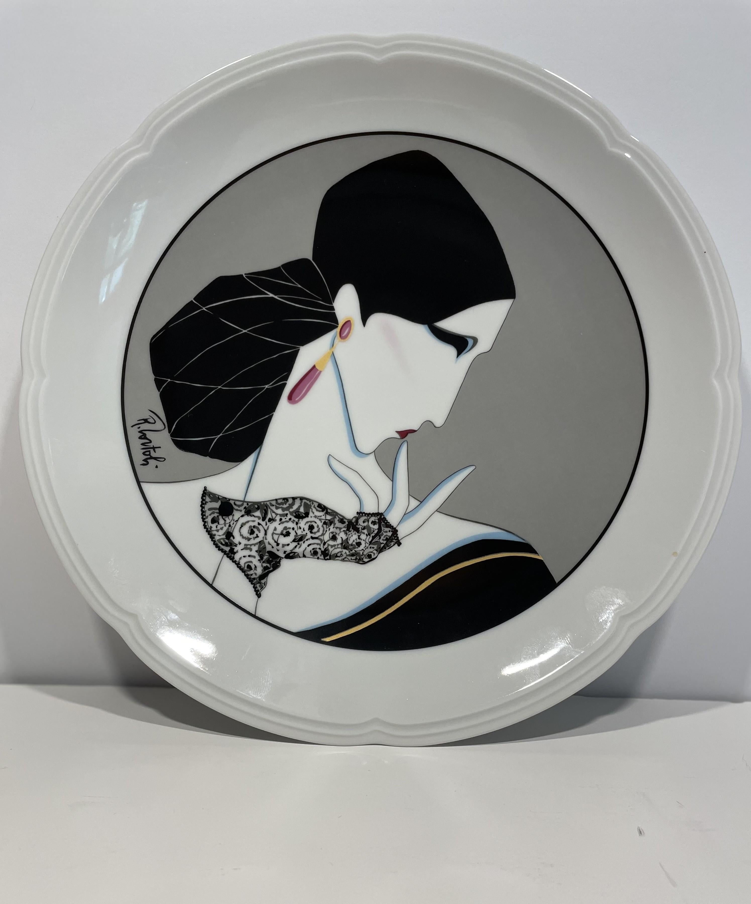 This set of four Art Deco dinner or desert plates is distinctive. There is a sophistication and modern elegance about this set! You are unlikely to see them coming-and-going. 

They are finely made in a crisp-white French porcelain with a soft,