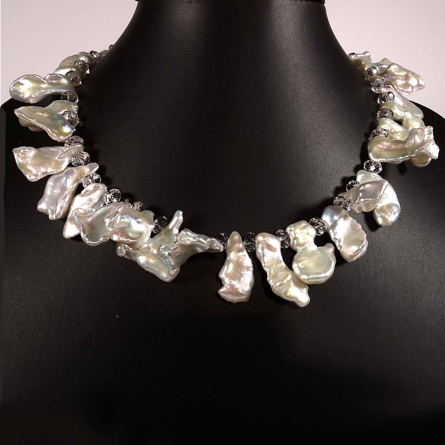 Necklace of White Iridescent freeform Pearls and faceted clear Quartz crystal rondels.  The Pearls are gently graduated from 17x9mm to 23x12mm.  This 14.5 inch choker necklace is secured with a Sterling Silver clasp.  See more from this seller by
