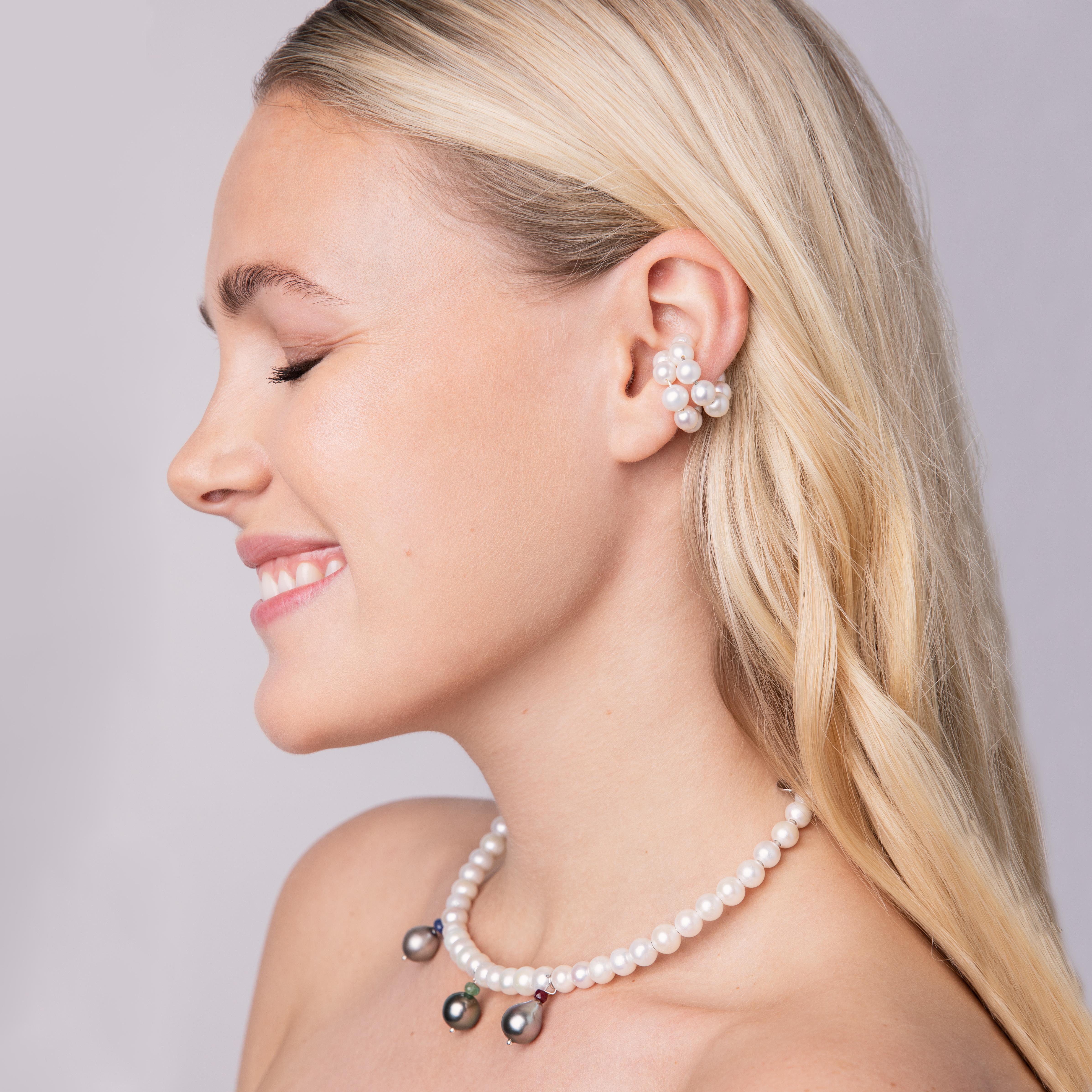 This Huggie is made of 5 mm white freshwater pearls. It is fashionable, stylish and also in clean design. 
Its shape is inspired by a classic piercing. You can easily bend the ear cuff open at the ends and put it on very easily. It upgrades any