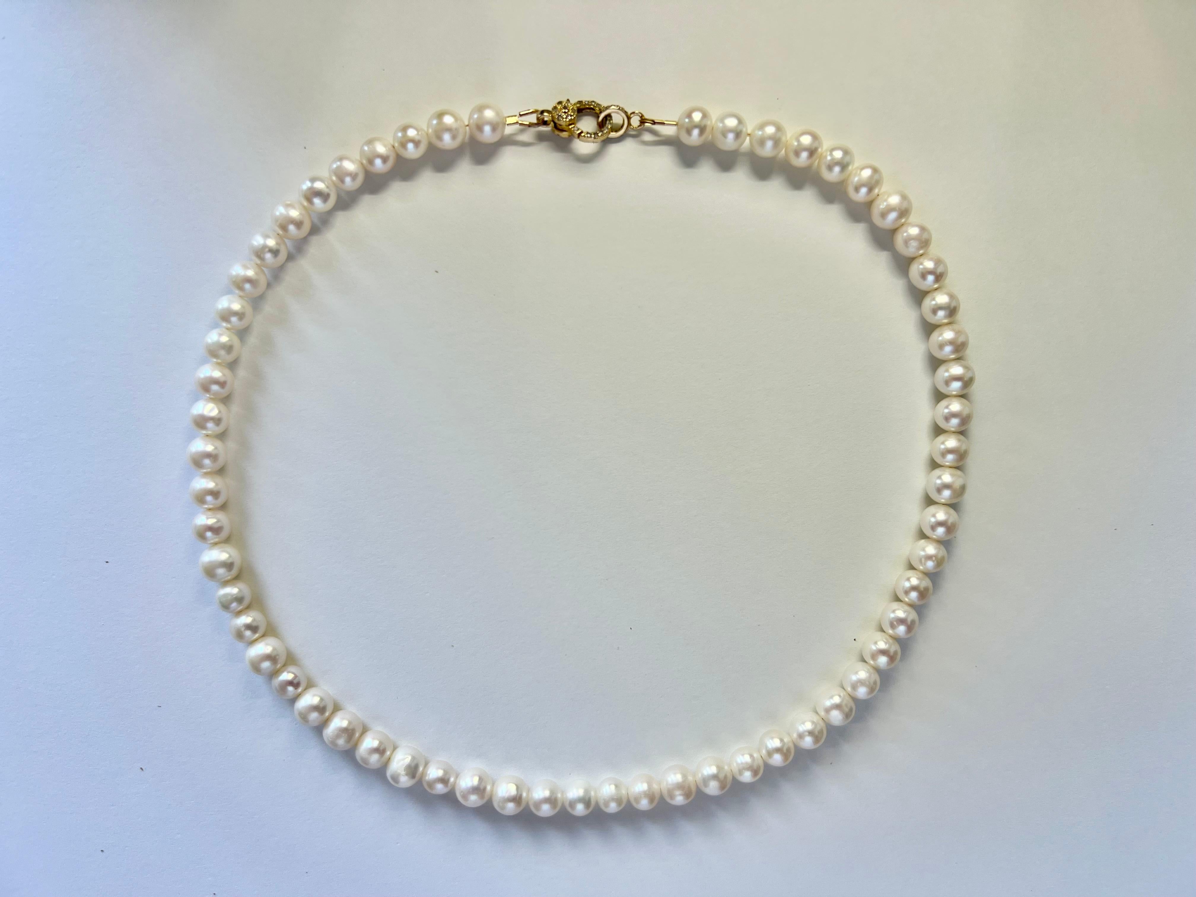 Introducing our exquisite white freshwater pearl necklace, a perfect blend of elegance and versatility. Crafted with AAA quality pearls, this necklace boasts a lustrous sheen reminiscent of the finest Akoya pearls. Each pearl, with a diameter of