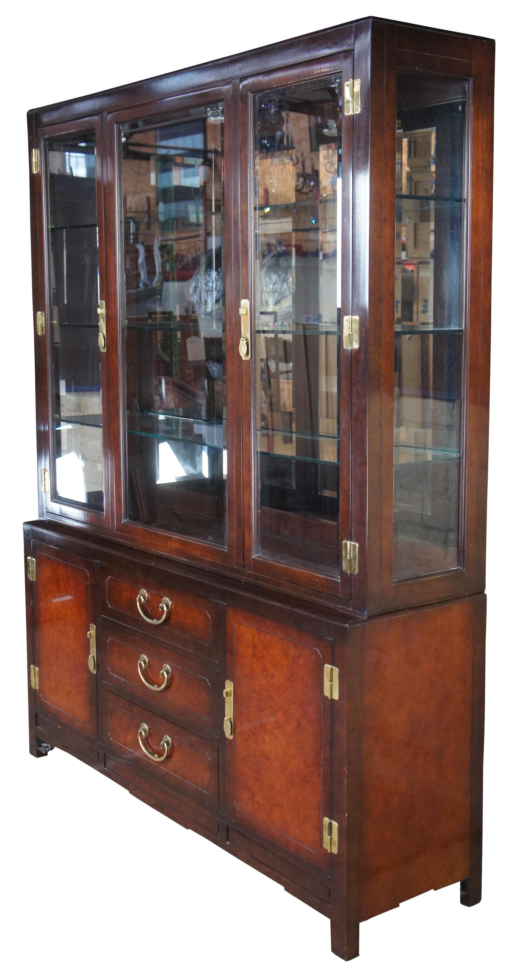 1987 White Furniture Ming dynasty styled Mandarin China Cabinet, 330-31 Rectangular form with mahogany and burlwood paneling. Features an illuminated step back top and brass hardware Illumination controlled by touching the of the brass hardware.
 