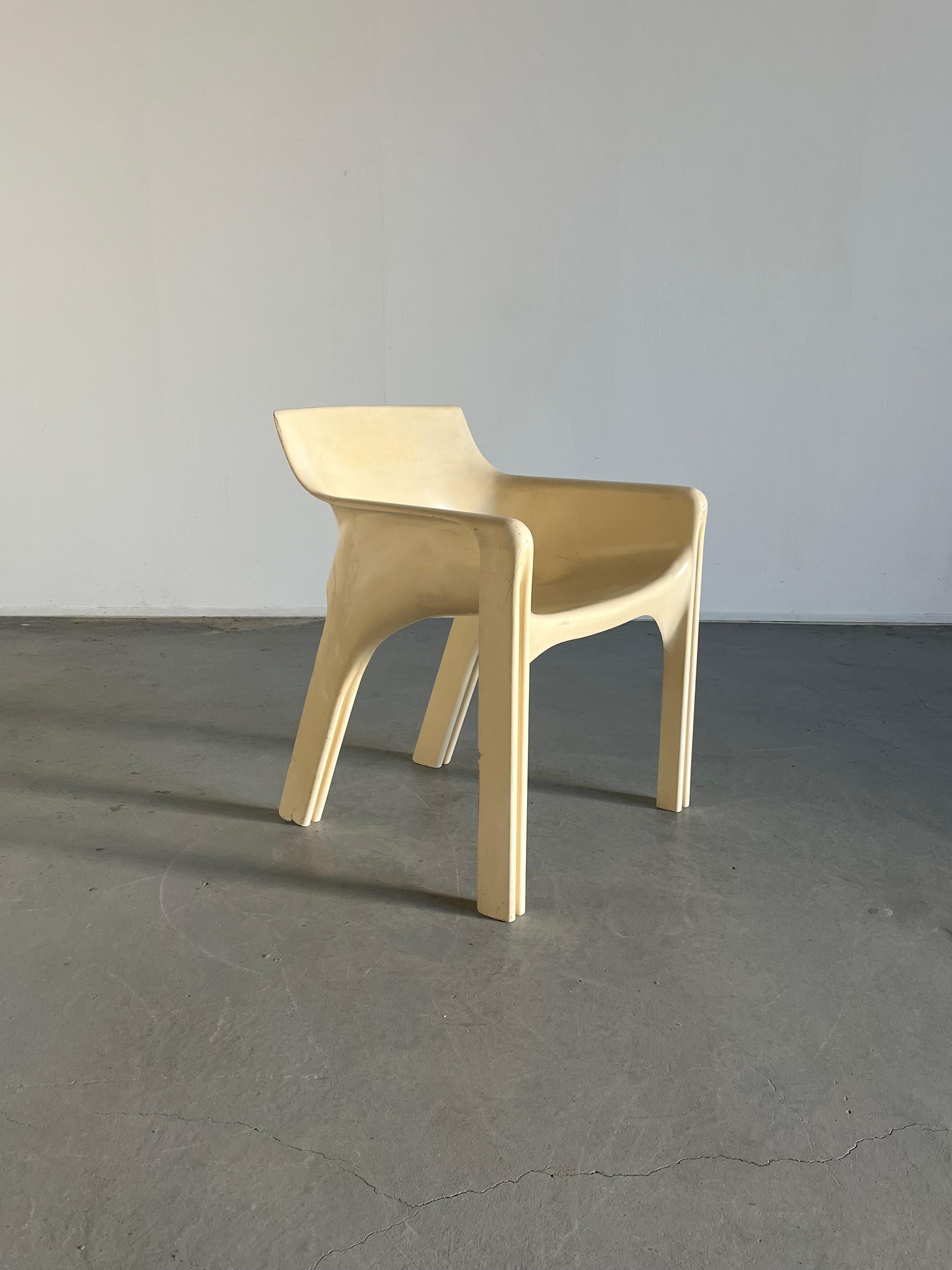 Iconic 'Gaudi' chair designed by Vico Magistretti and produced by Artemide, Italy. Named after Antonio Gaudi.

Single piece construction chair that comes from a pressure mold of polyester resin reinforced with fiberglas to withstand heat and