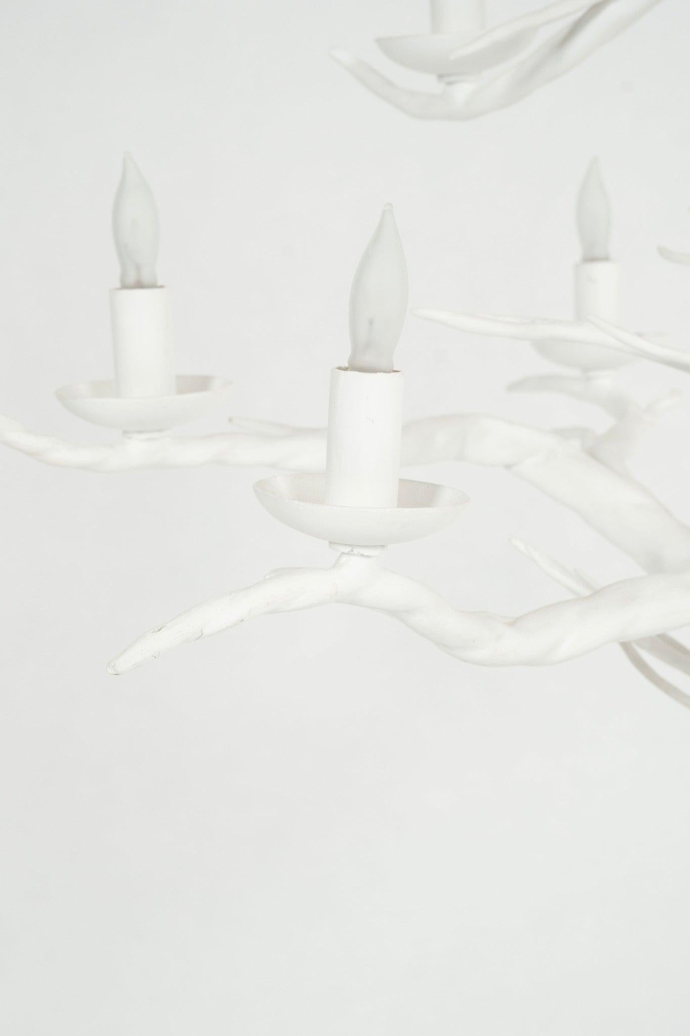 Embrace the outdoors indoors with this gessoed white branch chandelier.