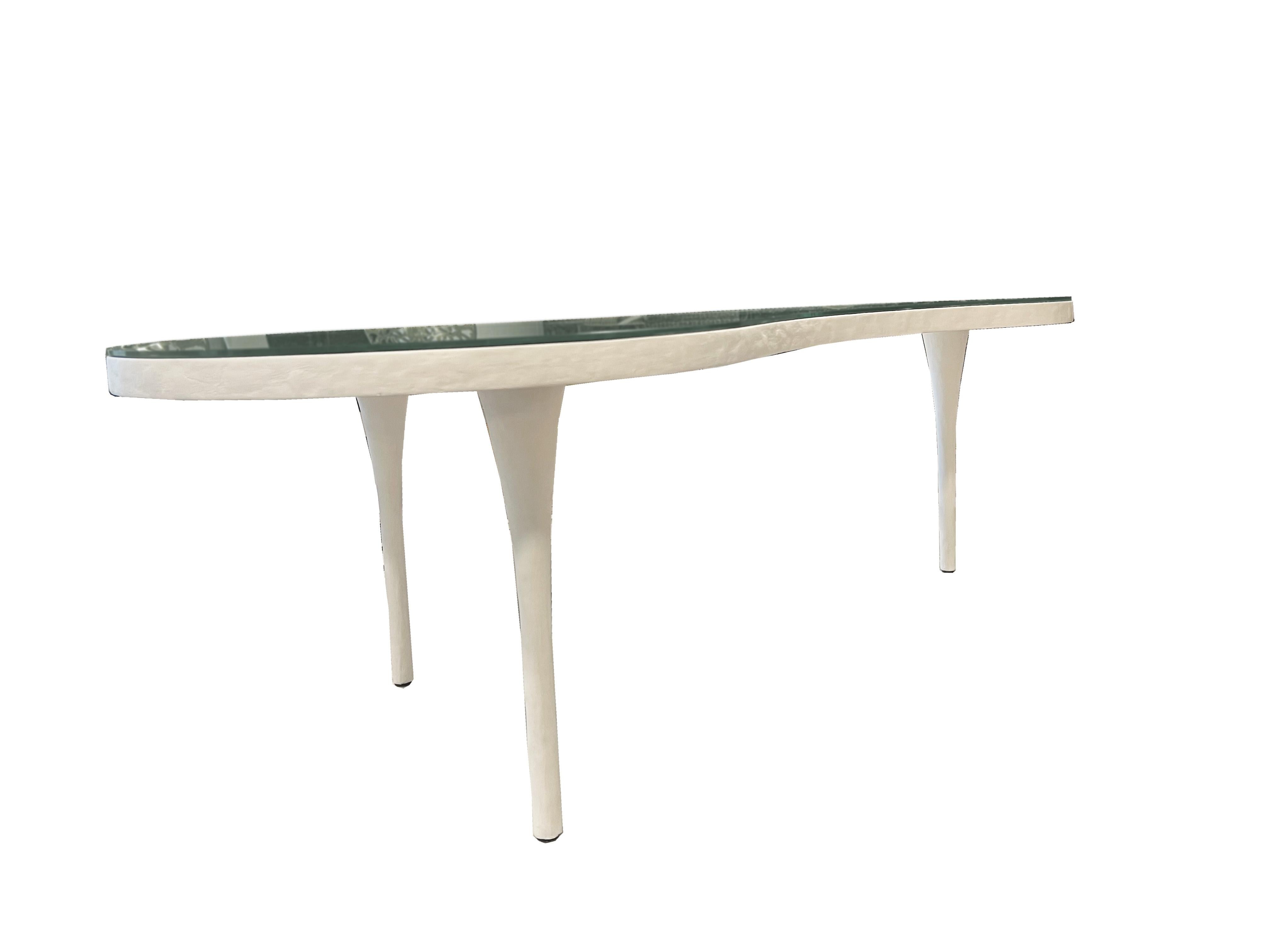 Introduce a touch of contemporary sophistication to your living space with the captivating White Remy coffee table, expertly crafted by Mr. Brown Home. This exquisite piece seamlessly combines sleek modernity with timeless elegance, making it a