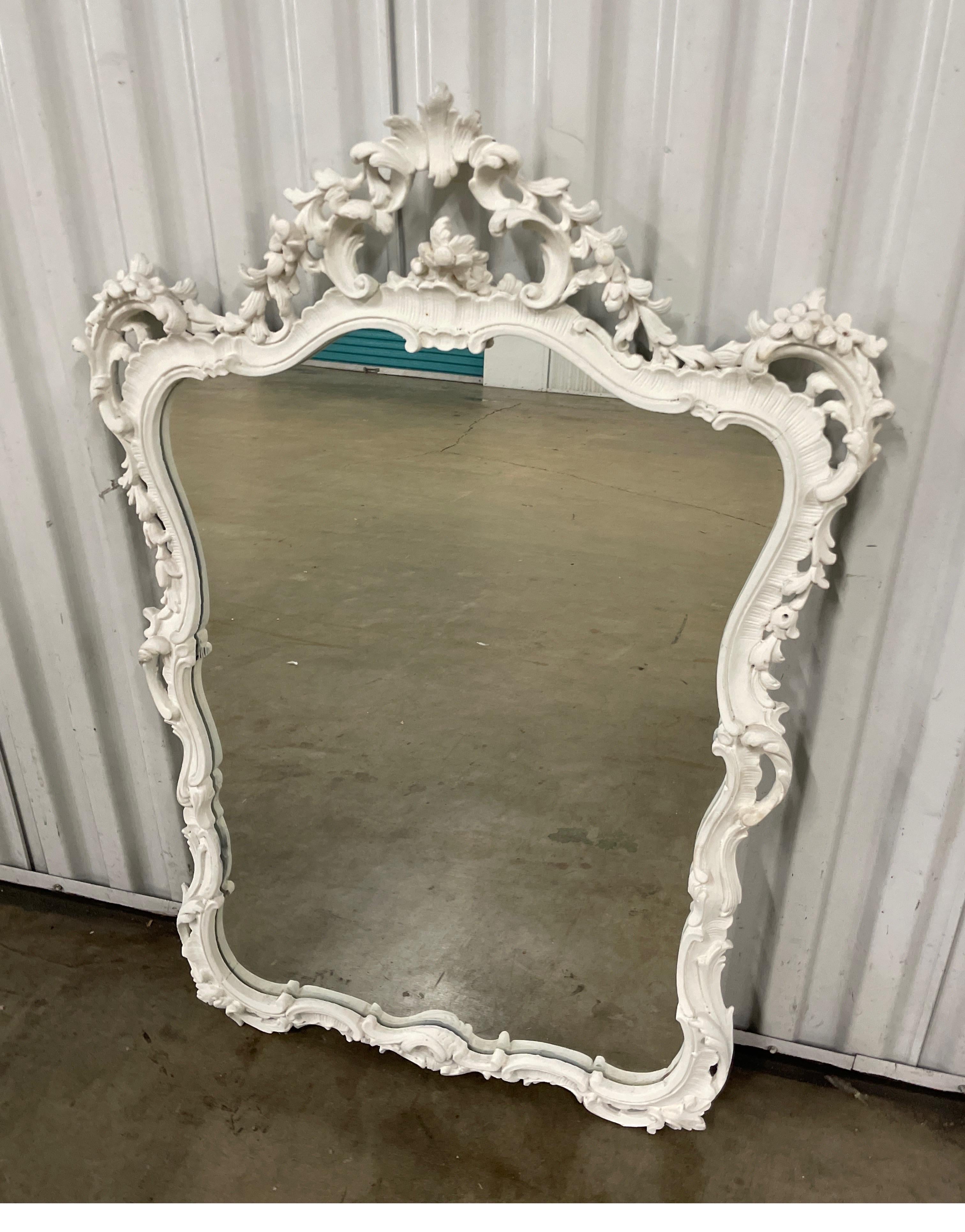 Gesso painted & hand carved Italian wall mirror. Beautifully carved details make this mirror very special. Will look great in a multitude of settings.