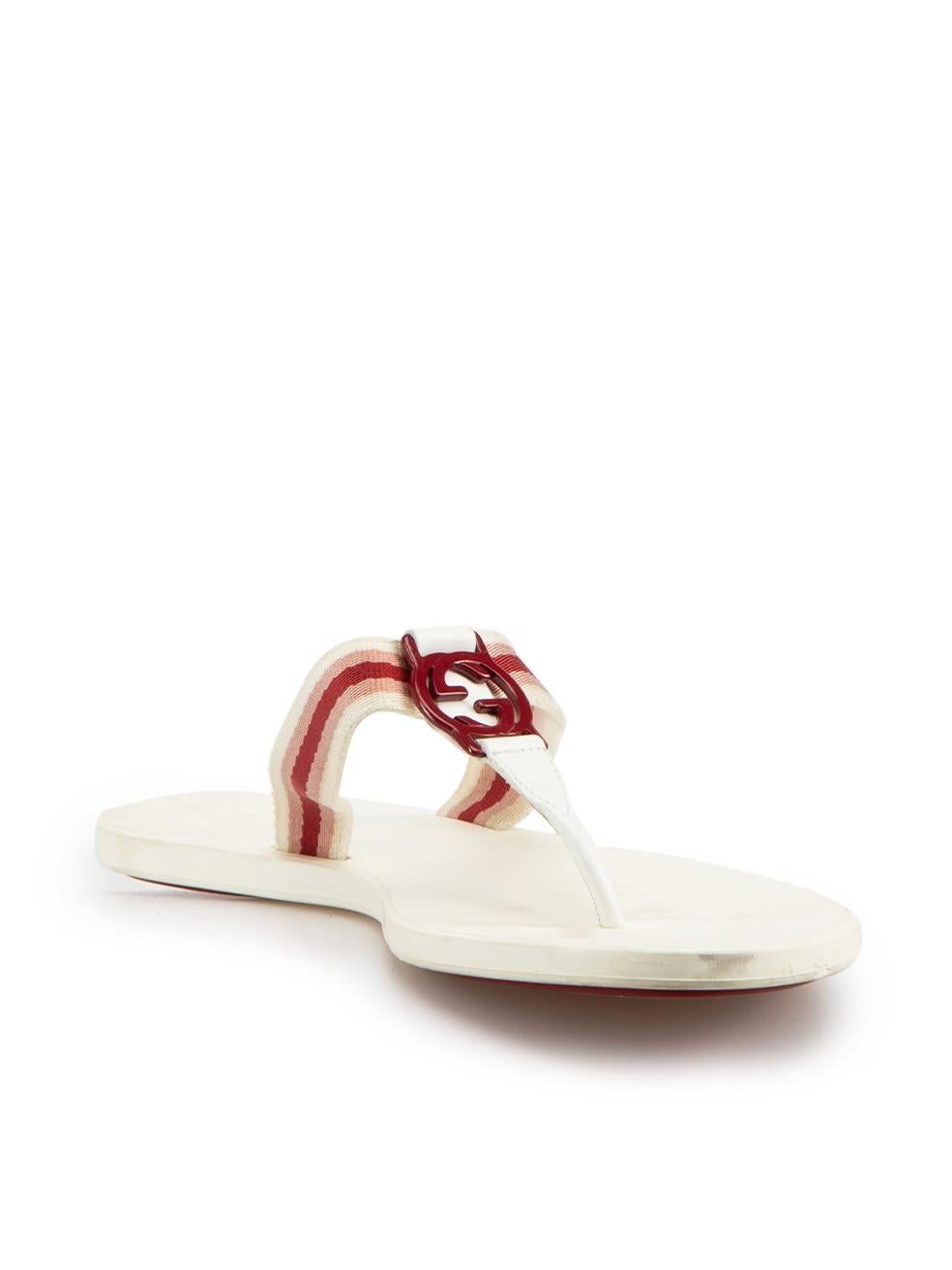CONDITION is Good. Minor wear to sandals is evident. Light discoloured marks to inner sole and scuff marks to strap detail on this used Gucci designer resale item.



Details


White

Leather

Thong sandals

Red striped cloth straps

'GG' logo