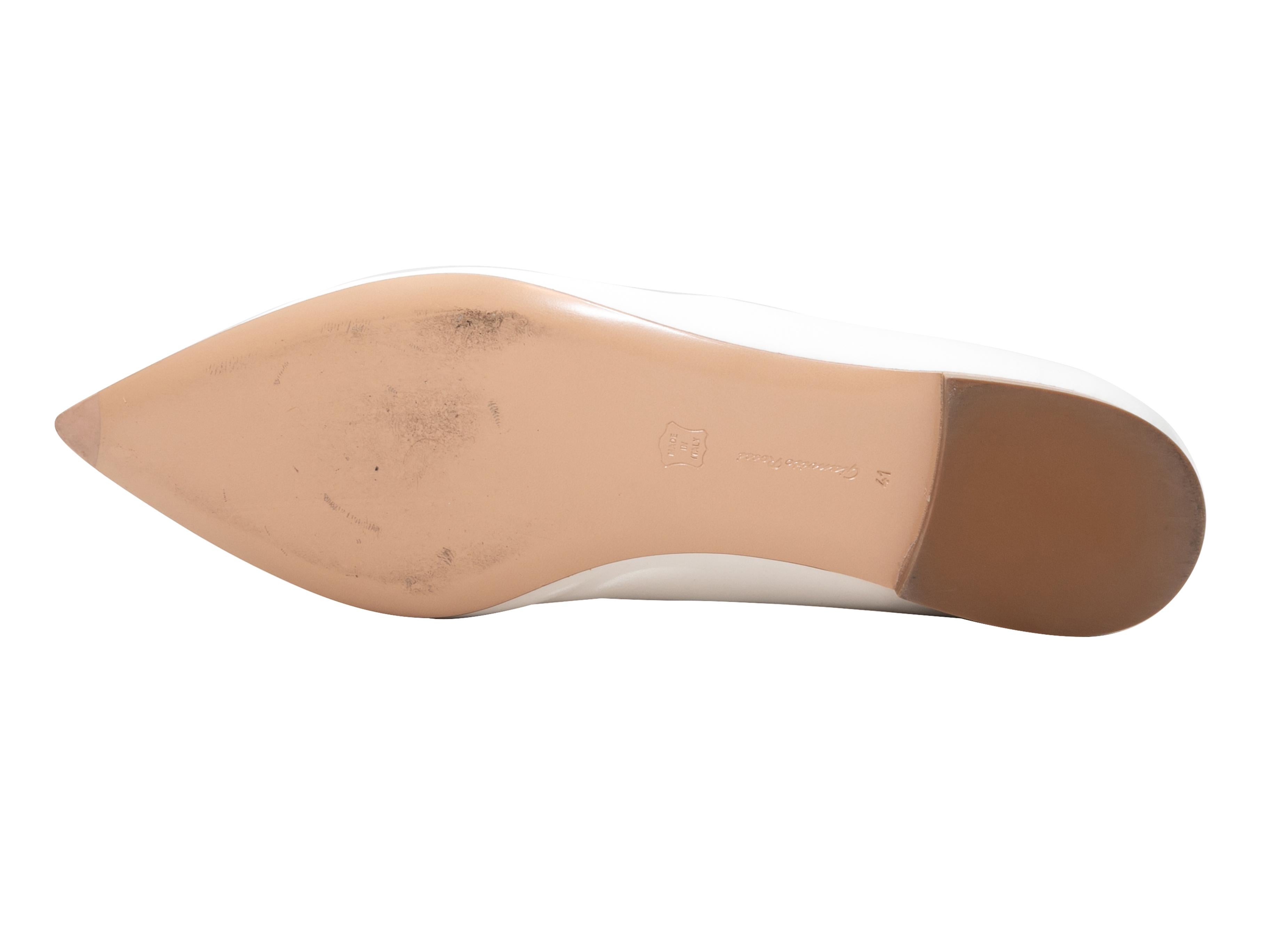 White satin pointed-toe Mary Jane ballet flats by Gianvito Rossi. Rhinestone embellishments at Mary Jane straps. 0.5