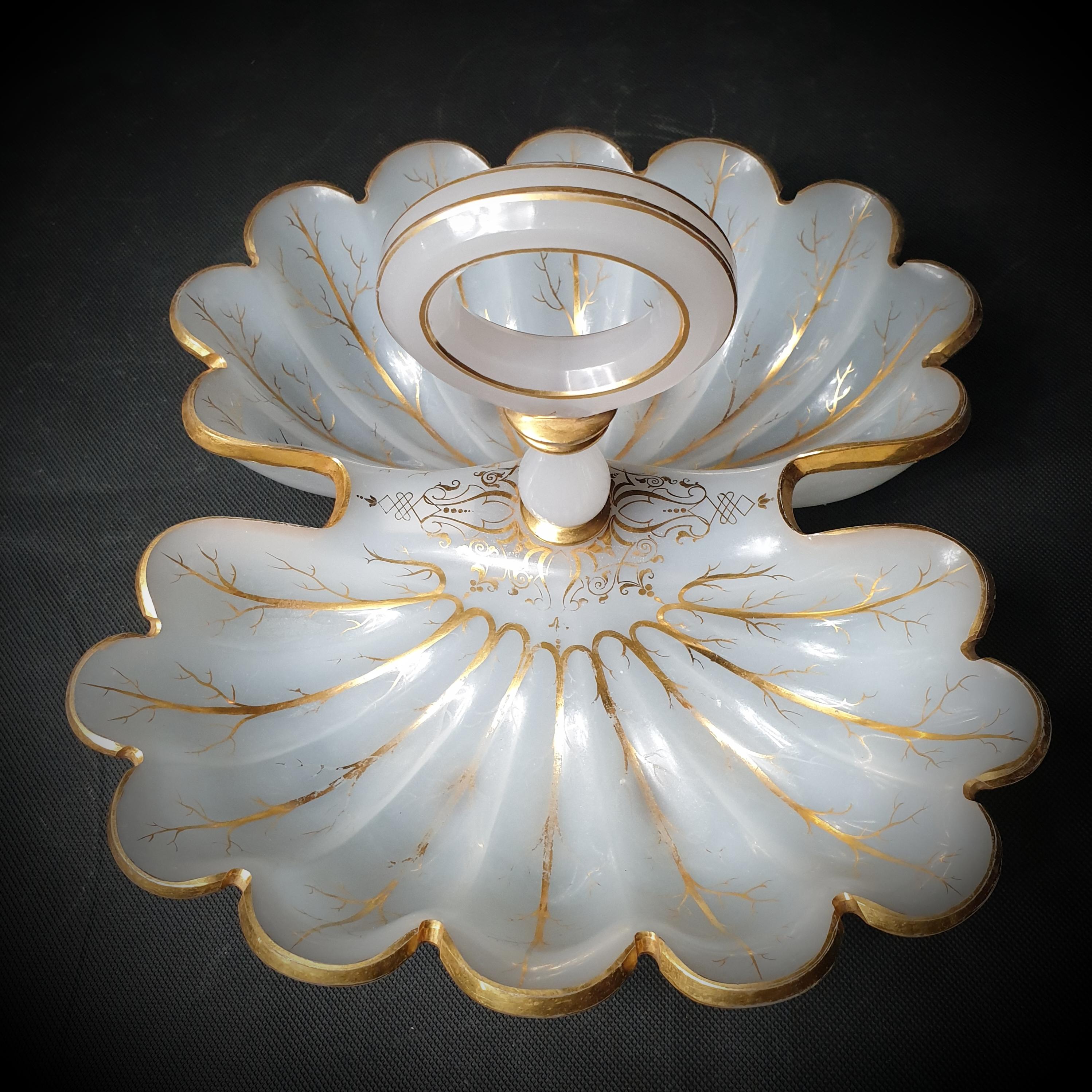 Presenting an excellent display of French history: the kidney-shaped, double scallop-shell, transparent, gilded, milky-white Opaline glass serving dish. With its elaborate pattern and delicate elegance, this serving dish is certainly a work of art,