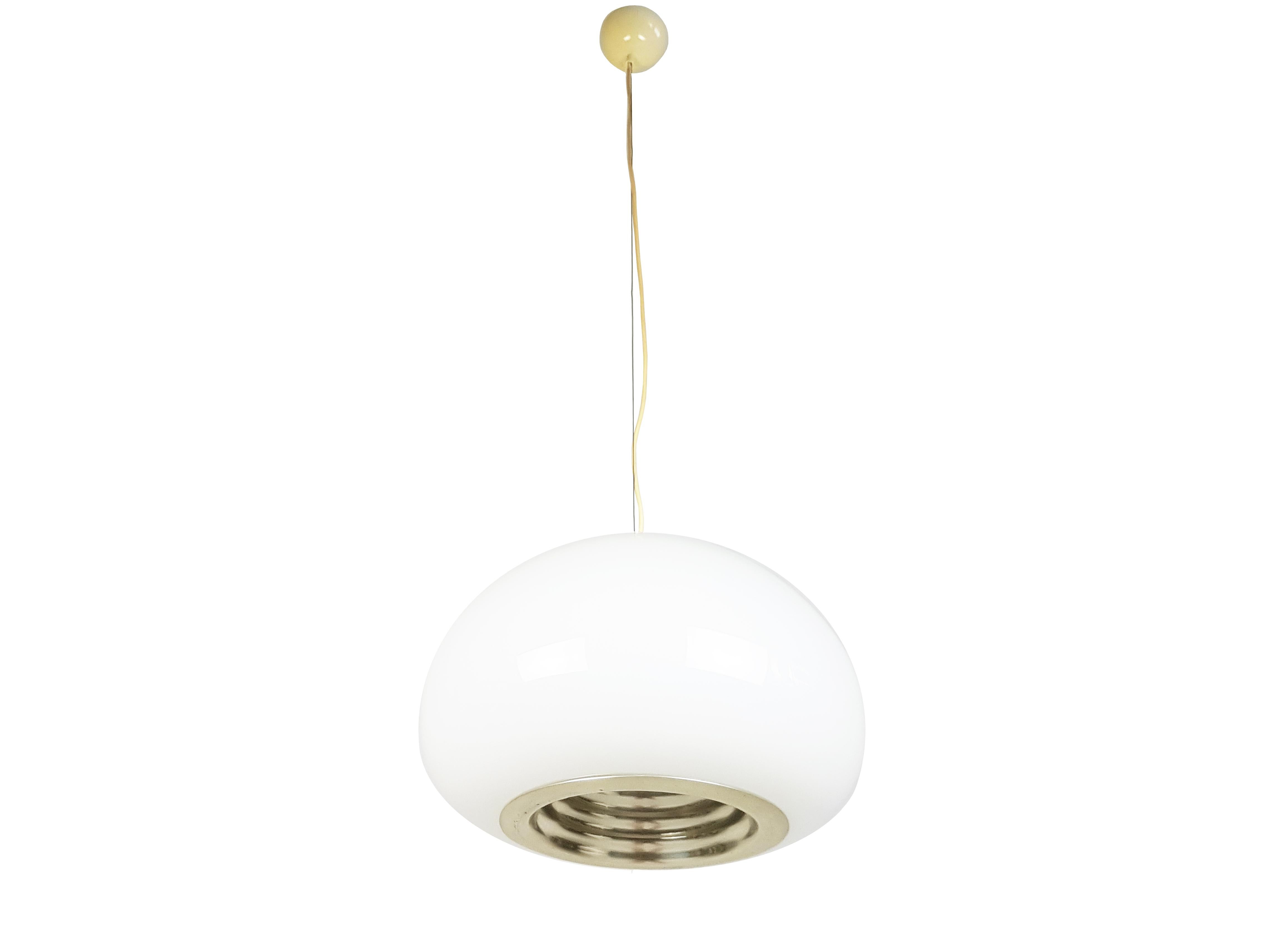 This out of production pendant was made from a white opaline glass shade with a shaped silver aluminum reflector. The lamp features 2 different illuminations: one diffused light from the 3 bulbs inside the glass shade; and one directed light from