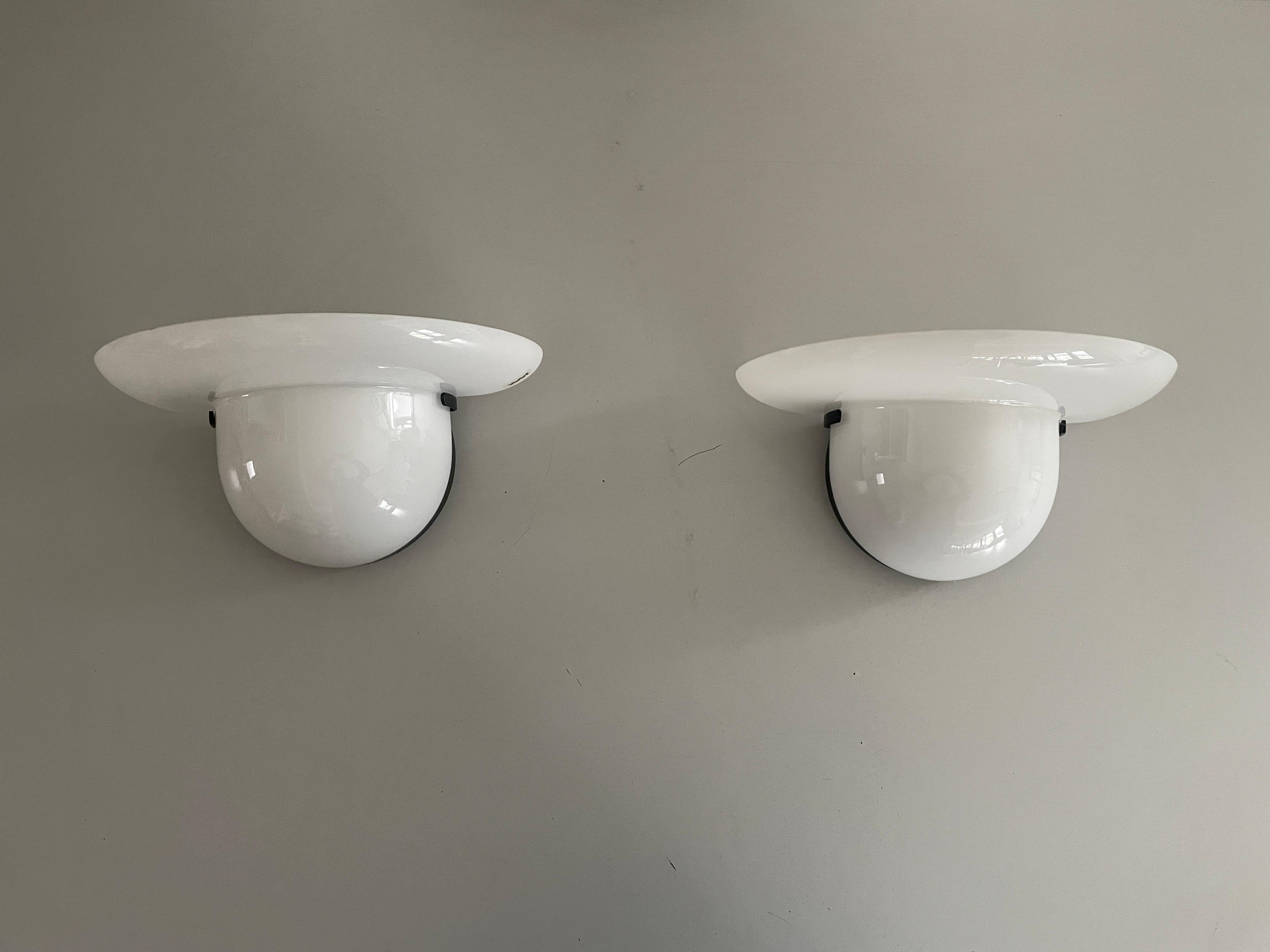 White Glass Pair of Sconces by VeArt, 1970s, Italy

Very nice high quality wall lamps.

Lamps are in very good vintage condition.


These lamps works with  E27 standard light bulbs. 
Wired and suitable to use in all countries. (110-220