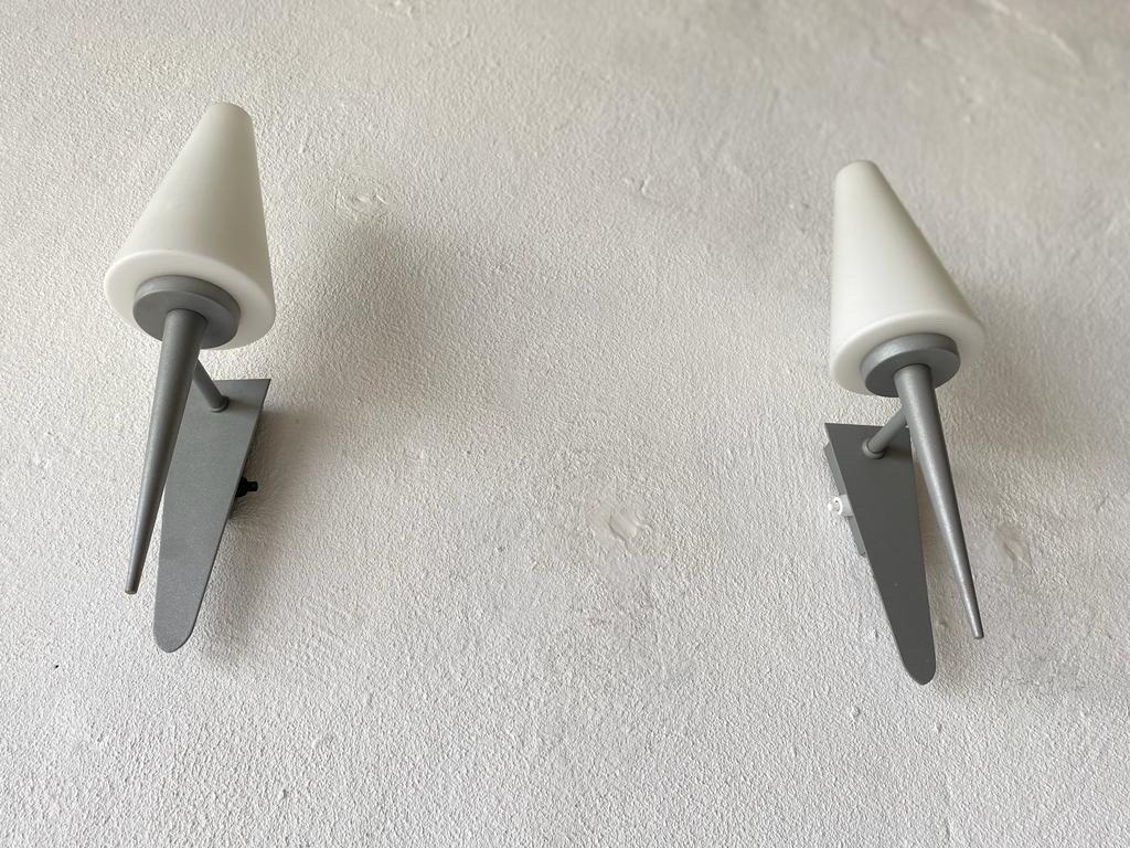 White Glass Pyramid Design Pair of Sconces by Böhmer Leuchten, 1970s, Germany

Very nice high quality wall lamps.

Lamps are in very good vintage condition.

These lamps works with E27 standard light bulbs. 
Wired and suitable to use in all