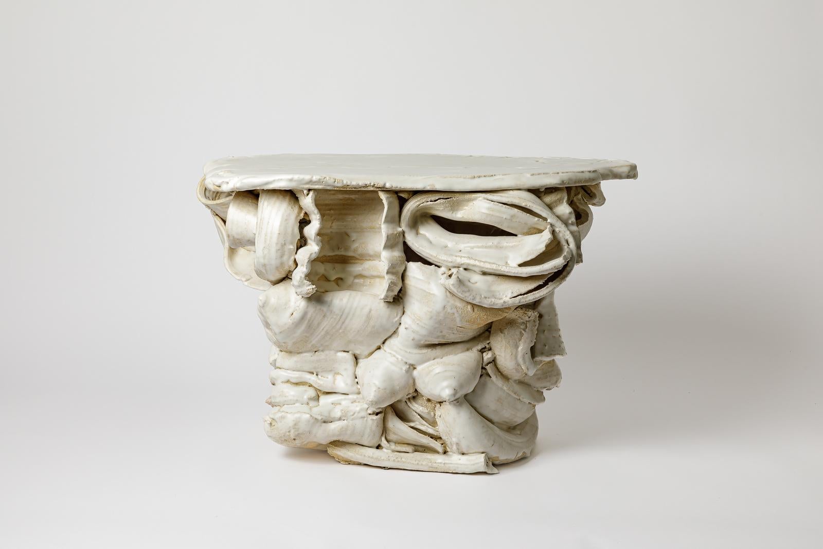Table en céramique émaillée blanche de Patrick Crulis.
2025. Pièce unique.
H : 16.5 x 14.6 x 25.2 pouces.
Dimensions approximatives.
