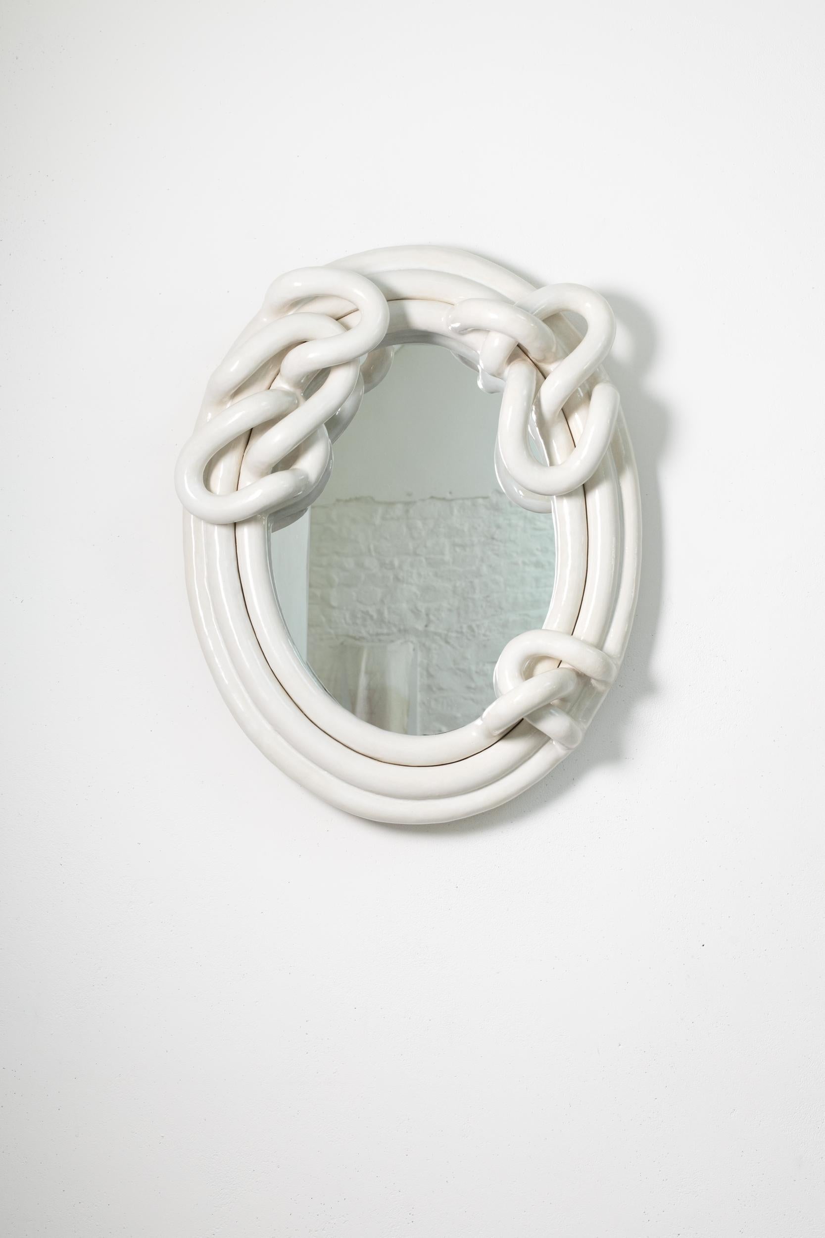White glazed stoneware mirror entitled « Médusé.e #3 » by Clémentine Dupré.
Artist signature on the back. 2024.
H : 26’8 x 21’2 x 5’9 inches.